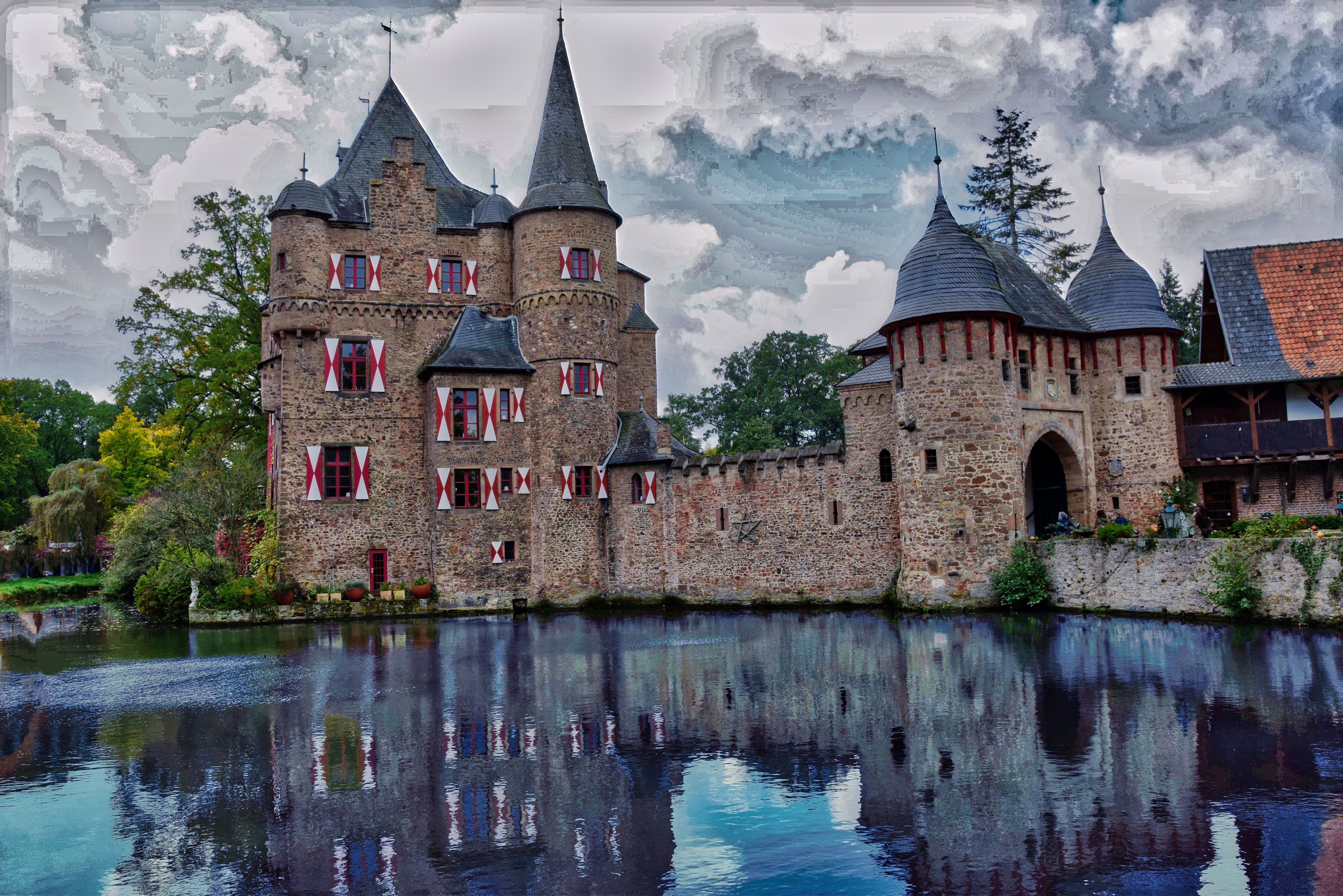 Concrete castle beside body of water photo