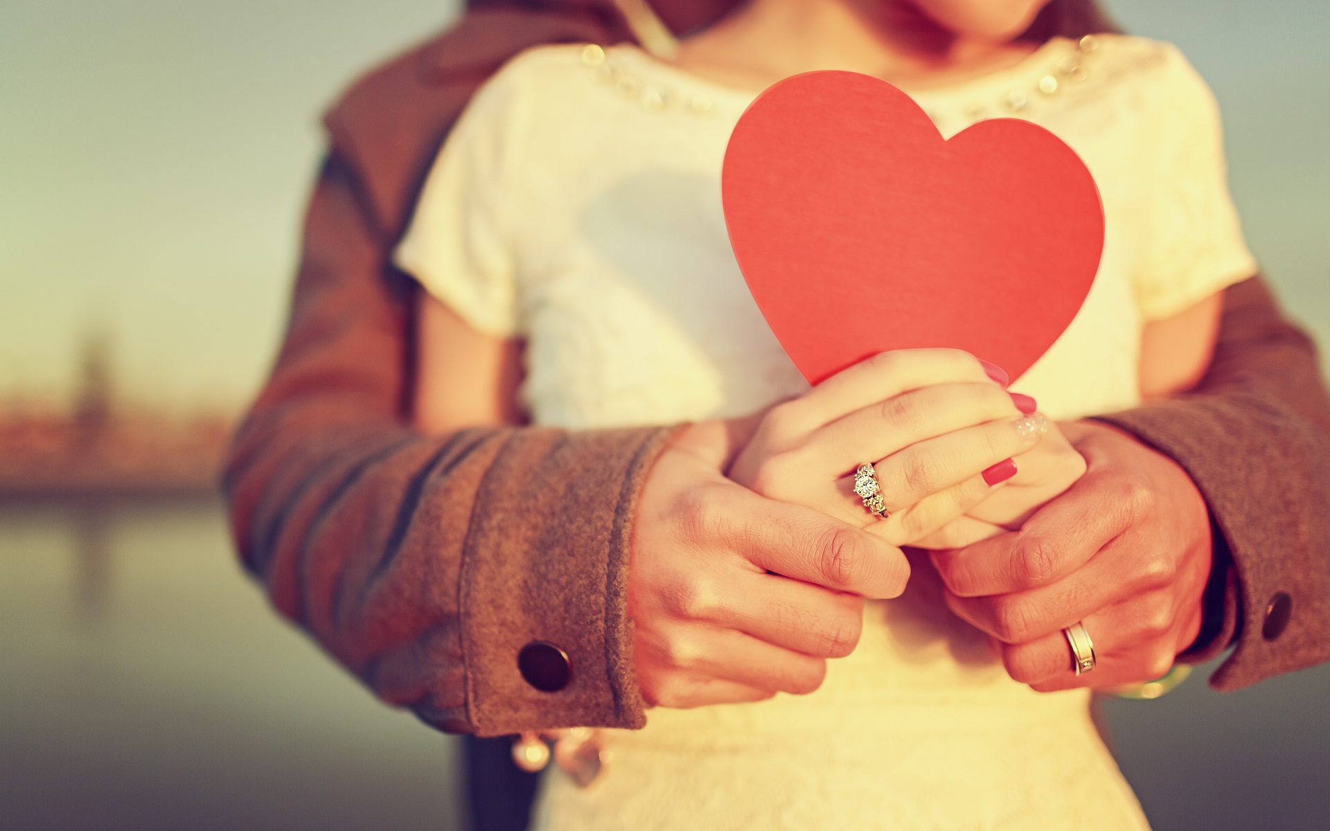 Couple-in-love-and-red-heart-in-hands - Hookup Apps
