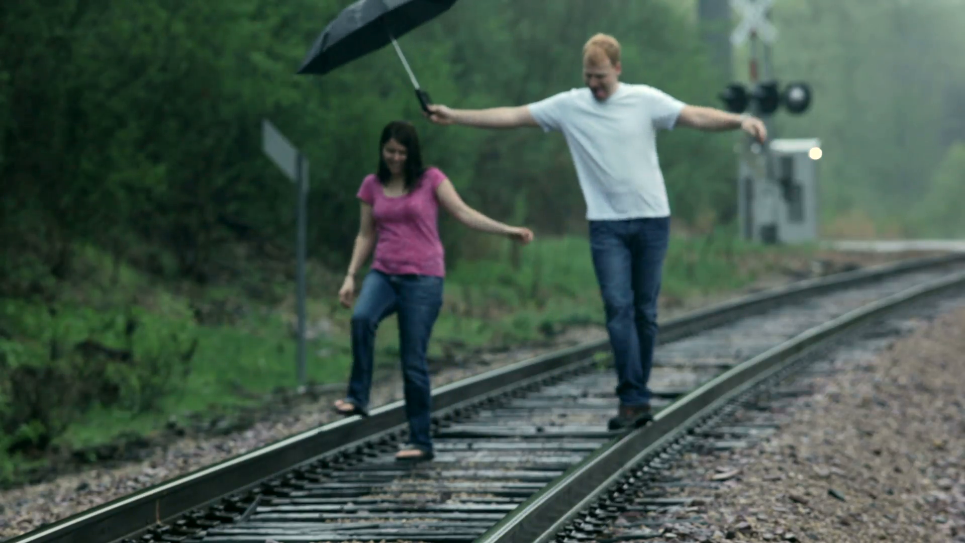 Couple Playfully Walking on Train Tracks Stock Video Footage ...