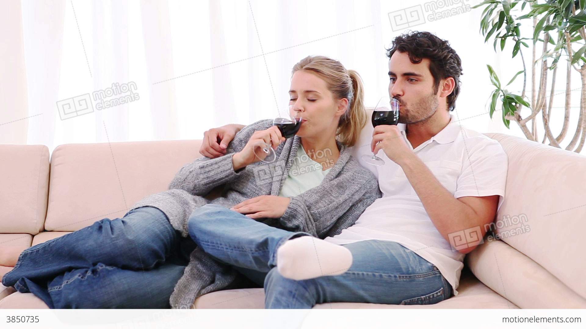 Couple Sitting On The Couch While Drinking Wine Stock video footage ...