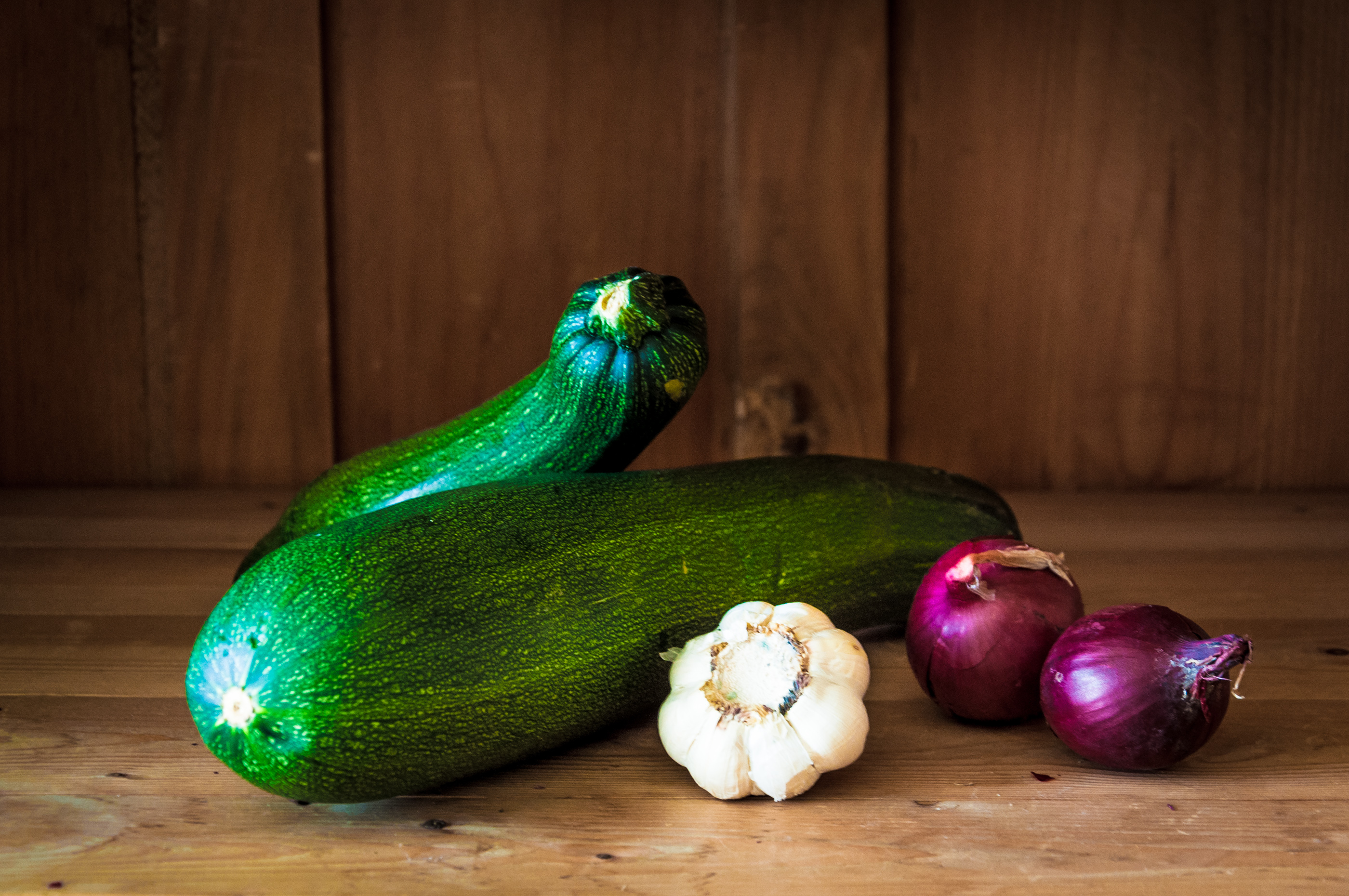 Courgette on wood background photo
