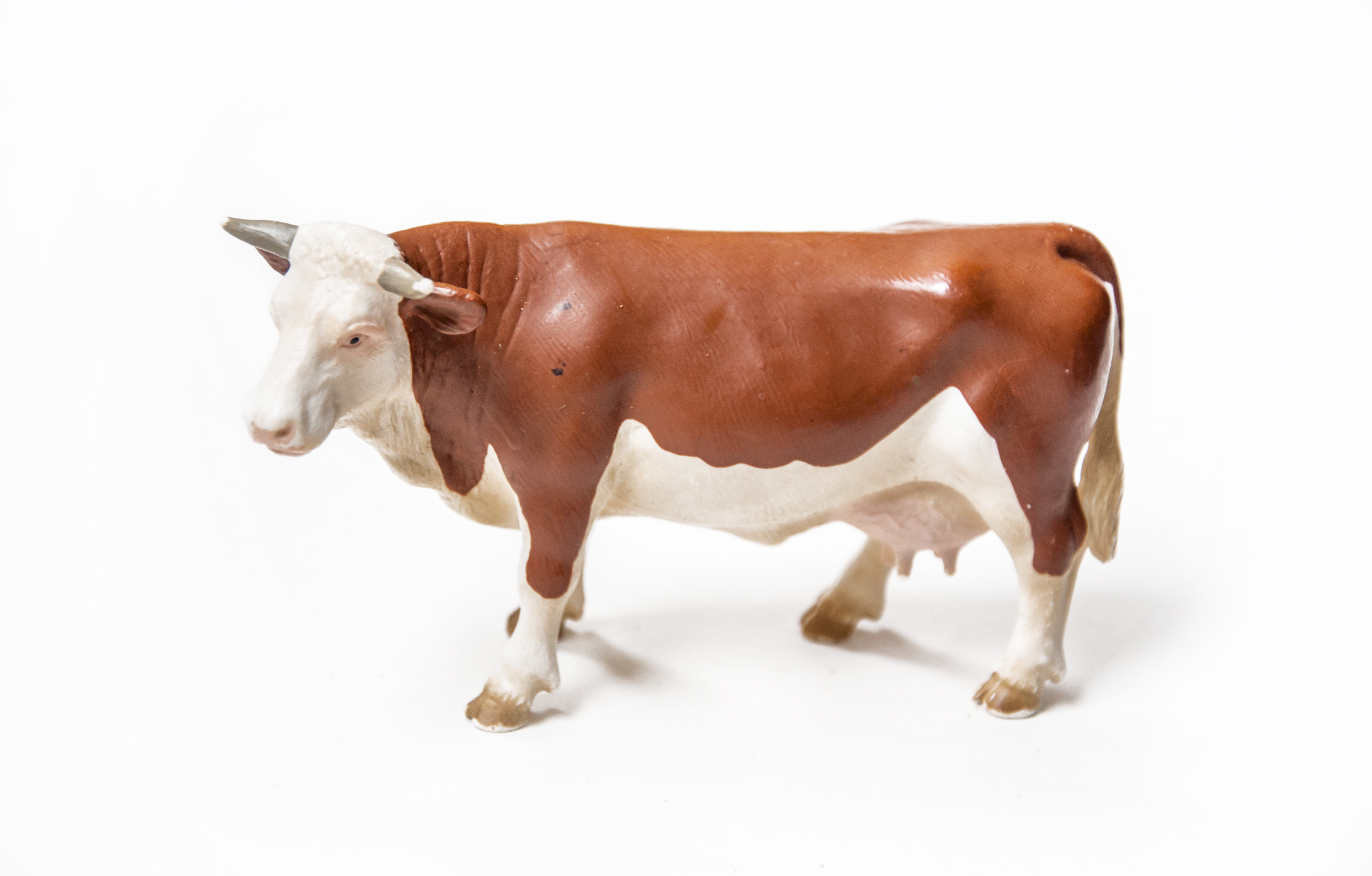 Cow plastic toy statue photo