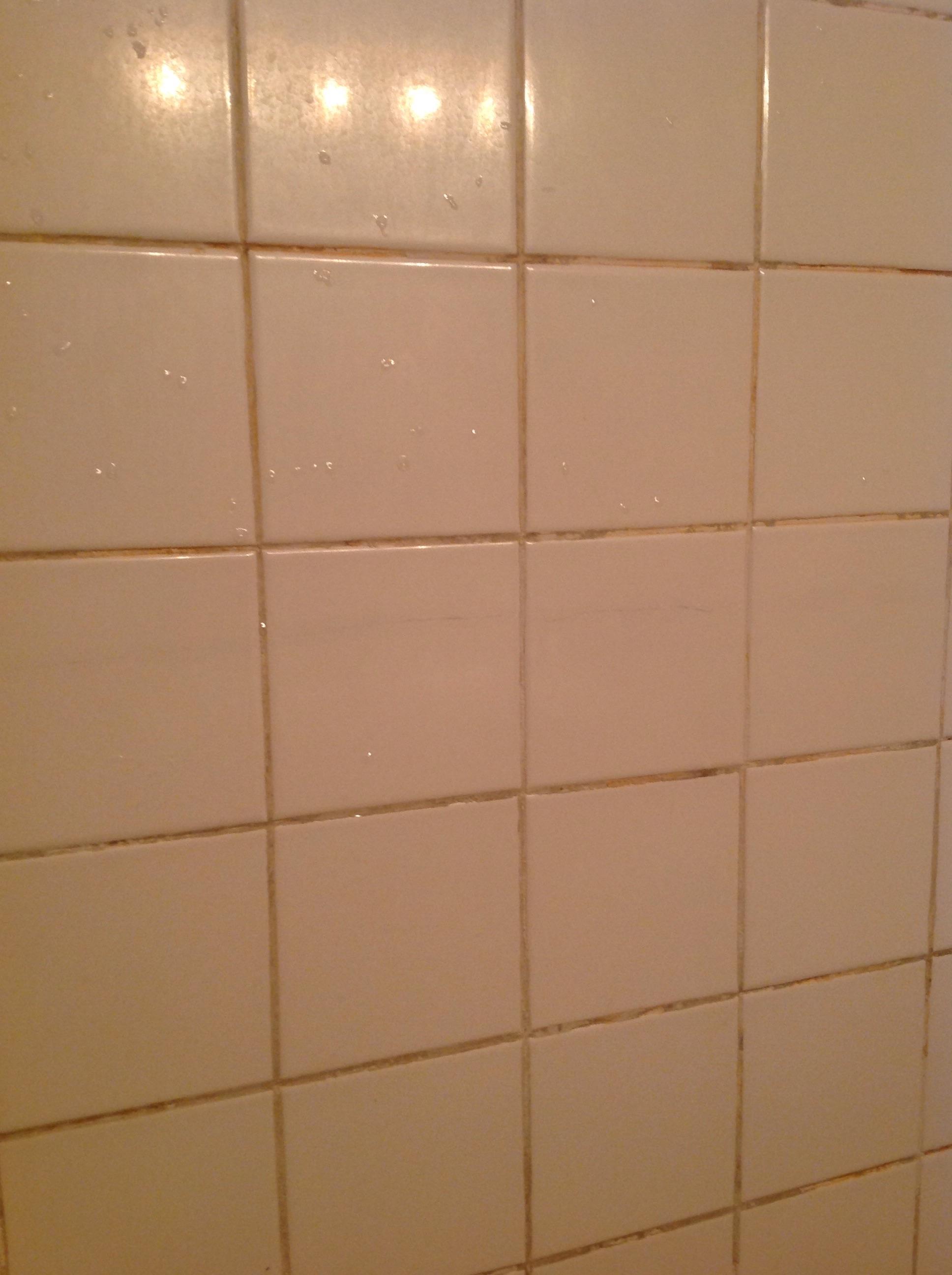 repair - Cracked bathroom tile - runs almost entire length of the ...