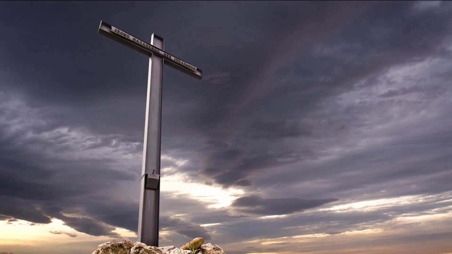 cross against a dramatic sky,stormy clouds crossing the sky in the ...