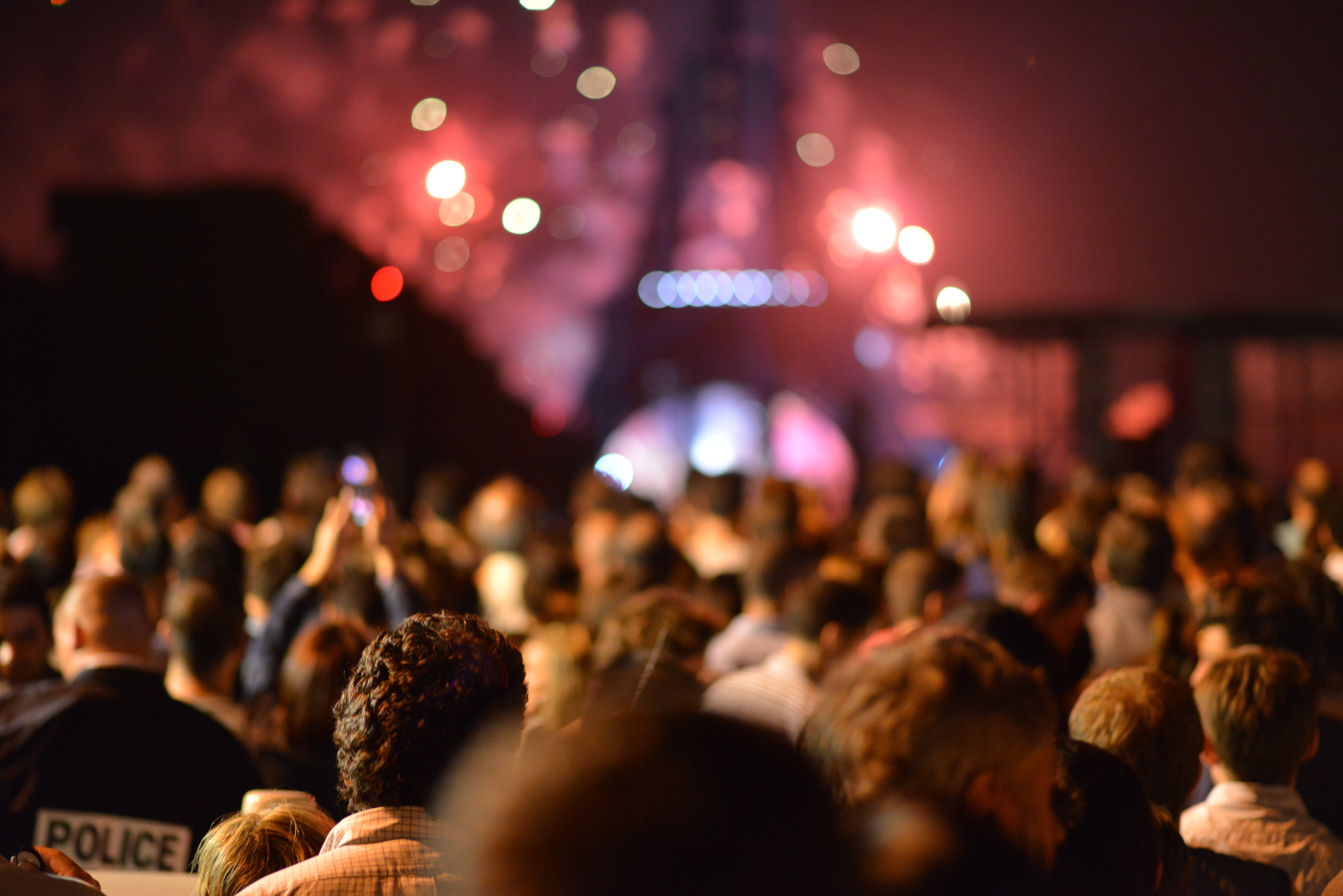 Crowd in front of fireworks at eiffel tower photo