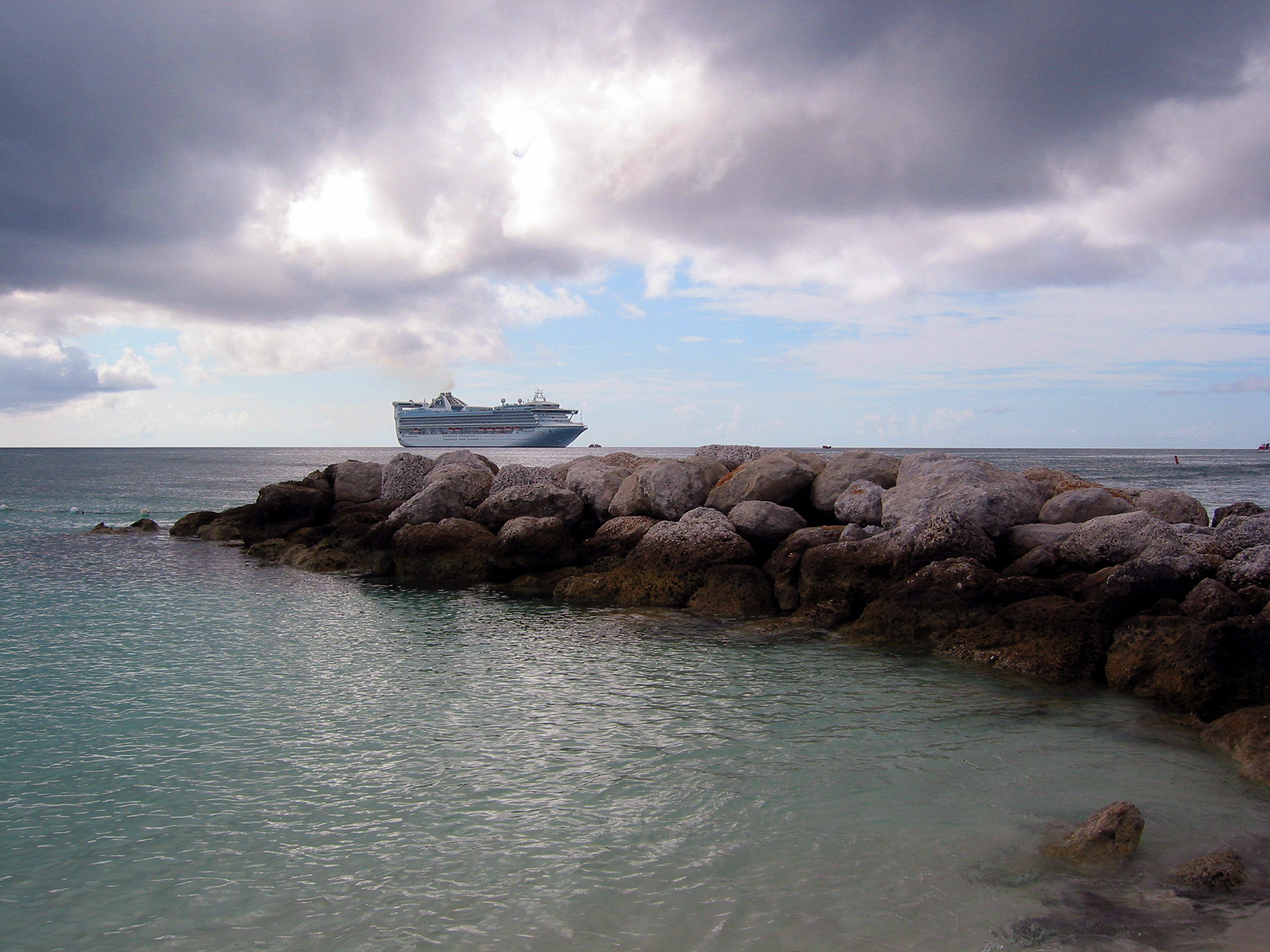 Cruise ship near the rocks photo