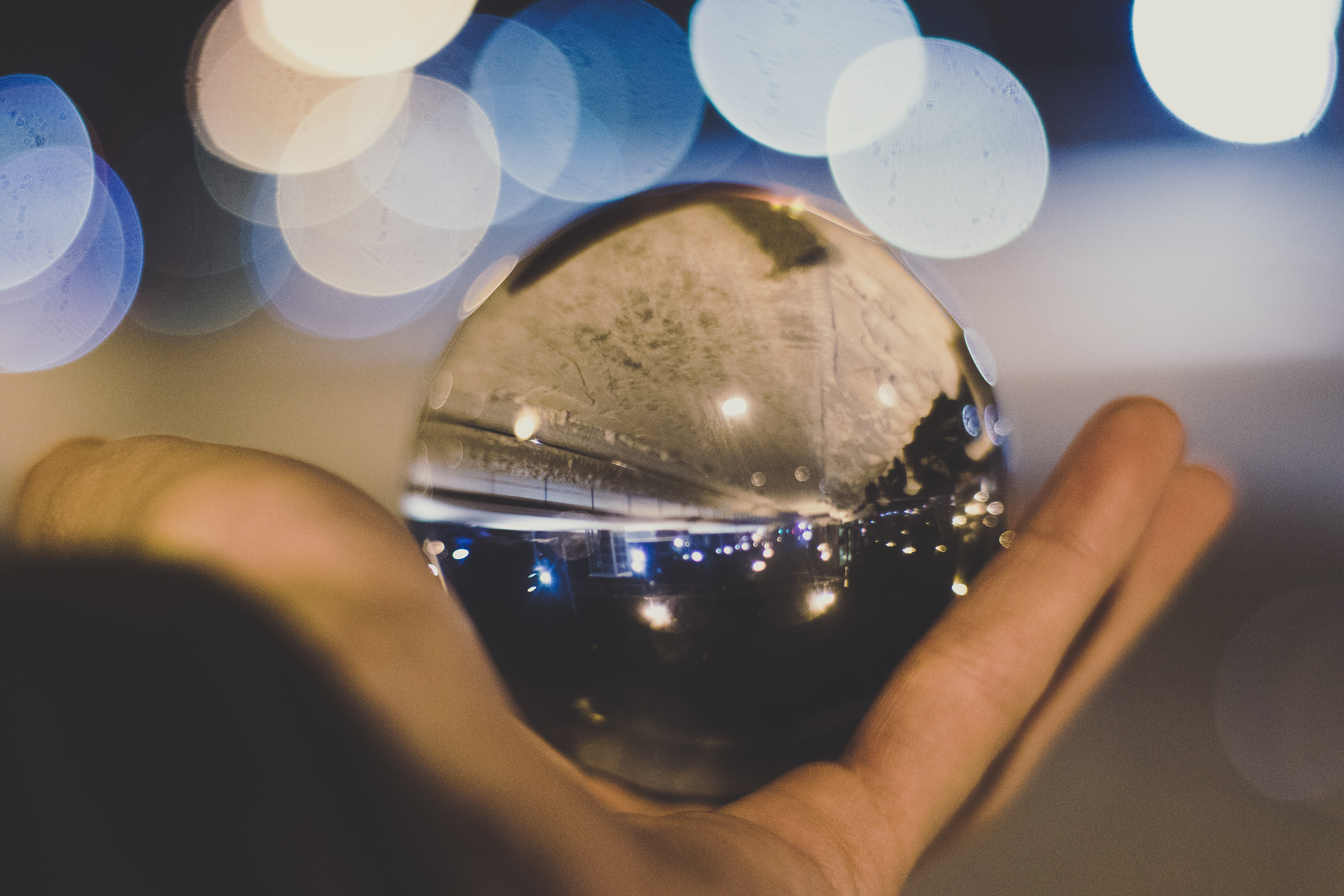Crystal ball on person's hand photo