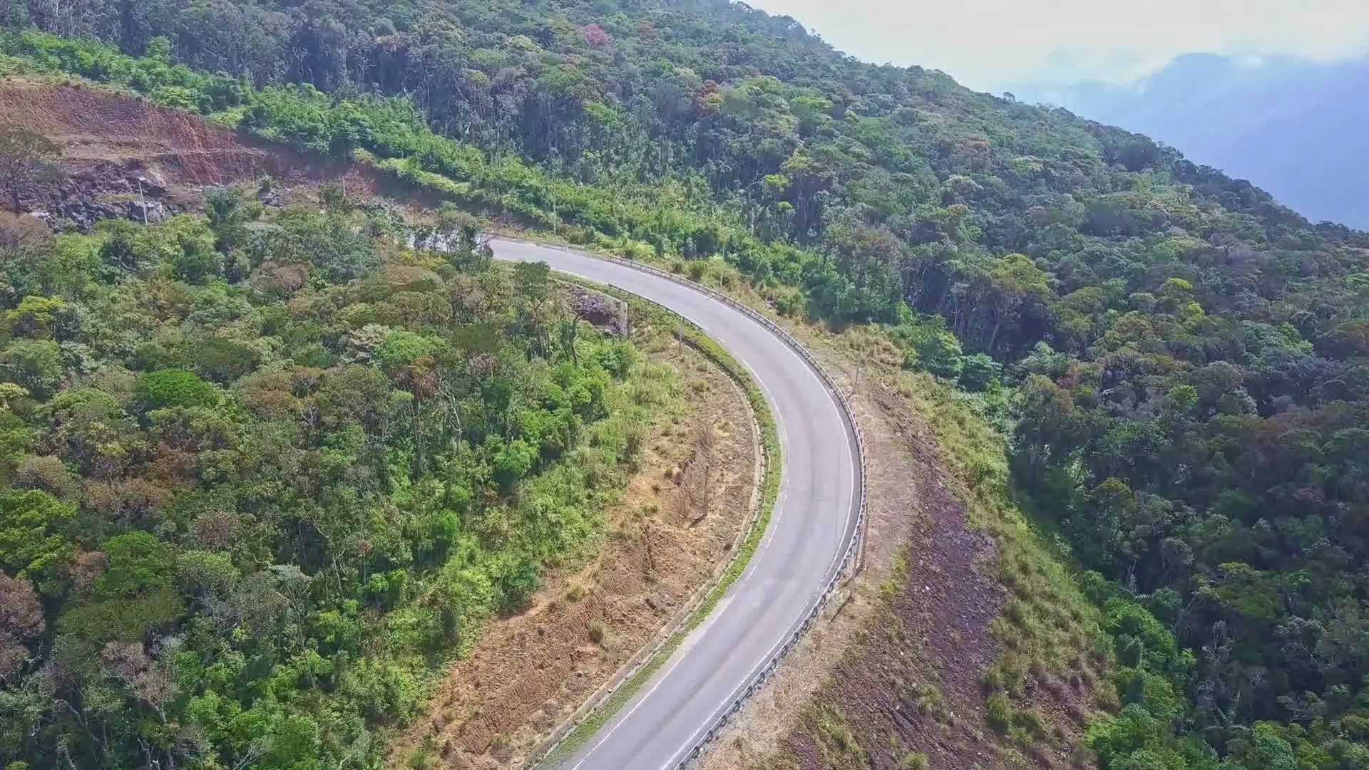 Drone Flies above Mountain Road Curve among Woods Stock Video ...