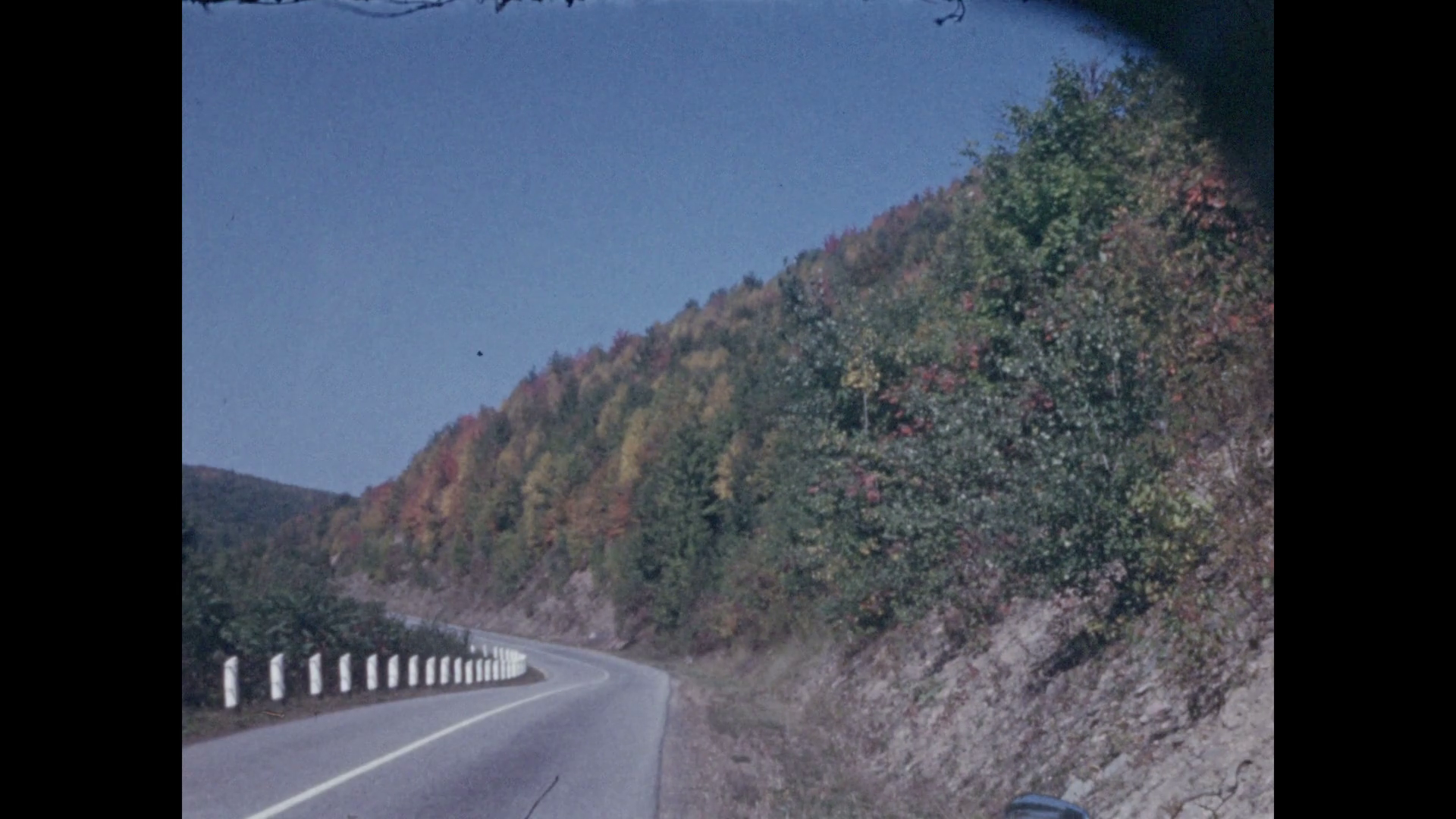 1940s: Curvy mountain road. Mountain valley vista. Curvy mountain ...