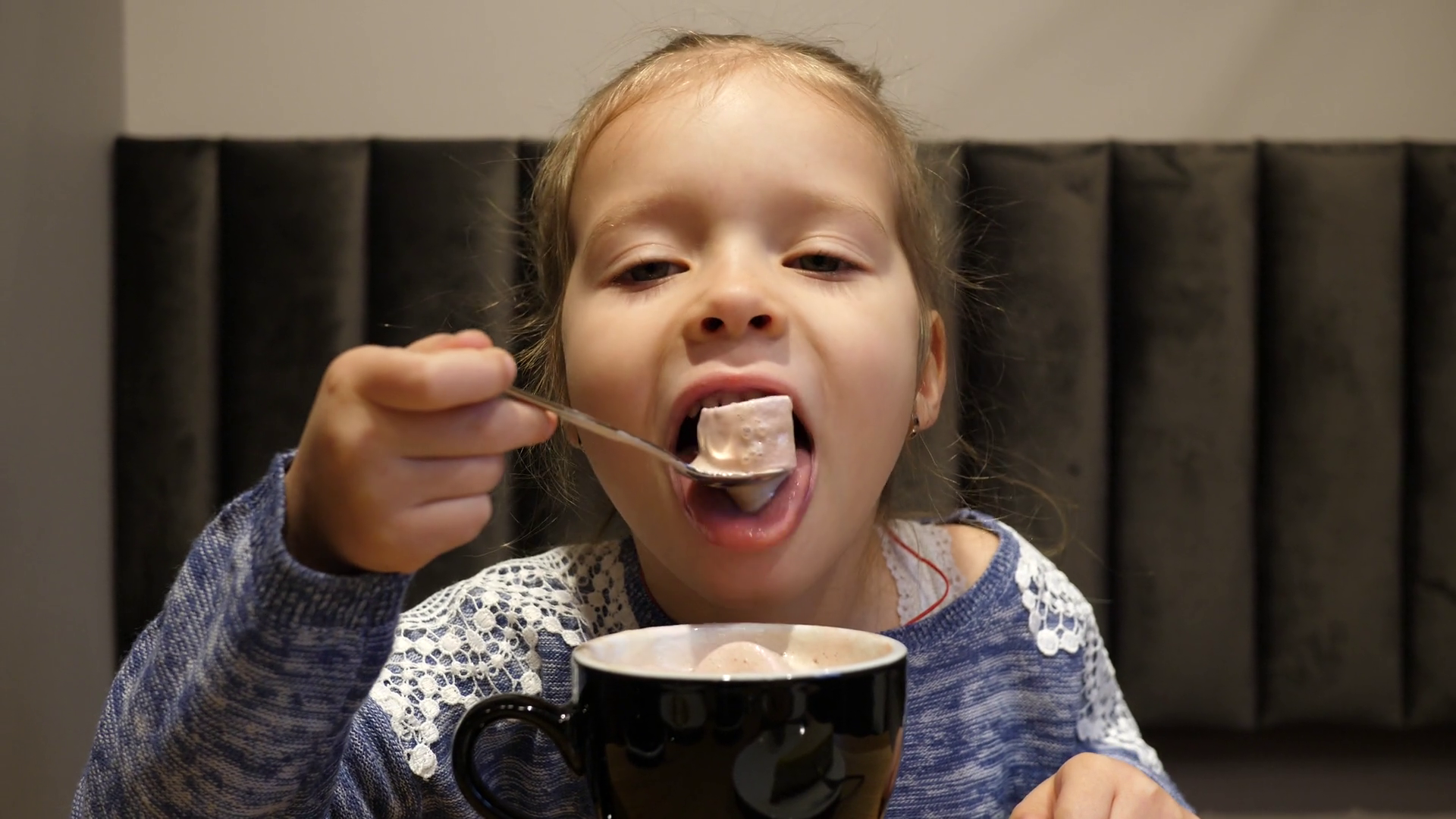 Cute Little Kid Girl In Cafe Bar Enjoy Eating Sweet Marshmallow From ...