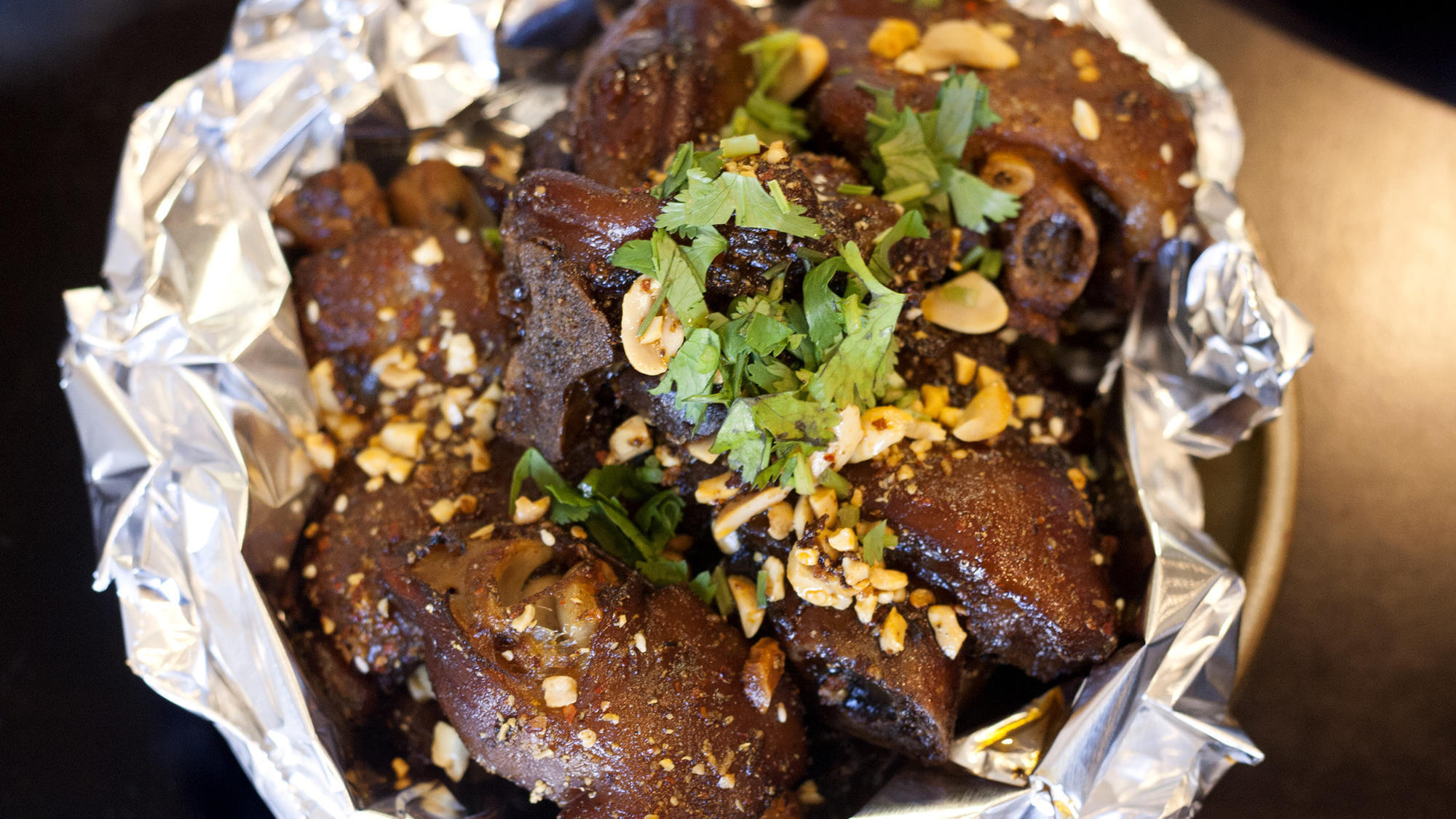 Eat This: Roasted pork feet at A Place by Damao - Chicago Tribune