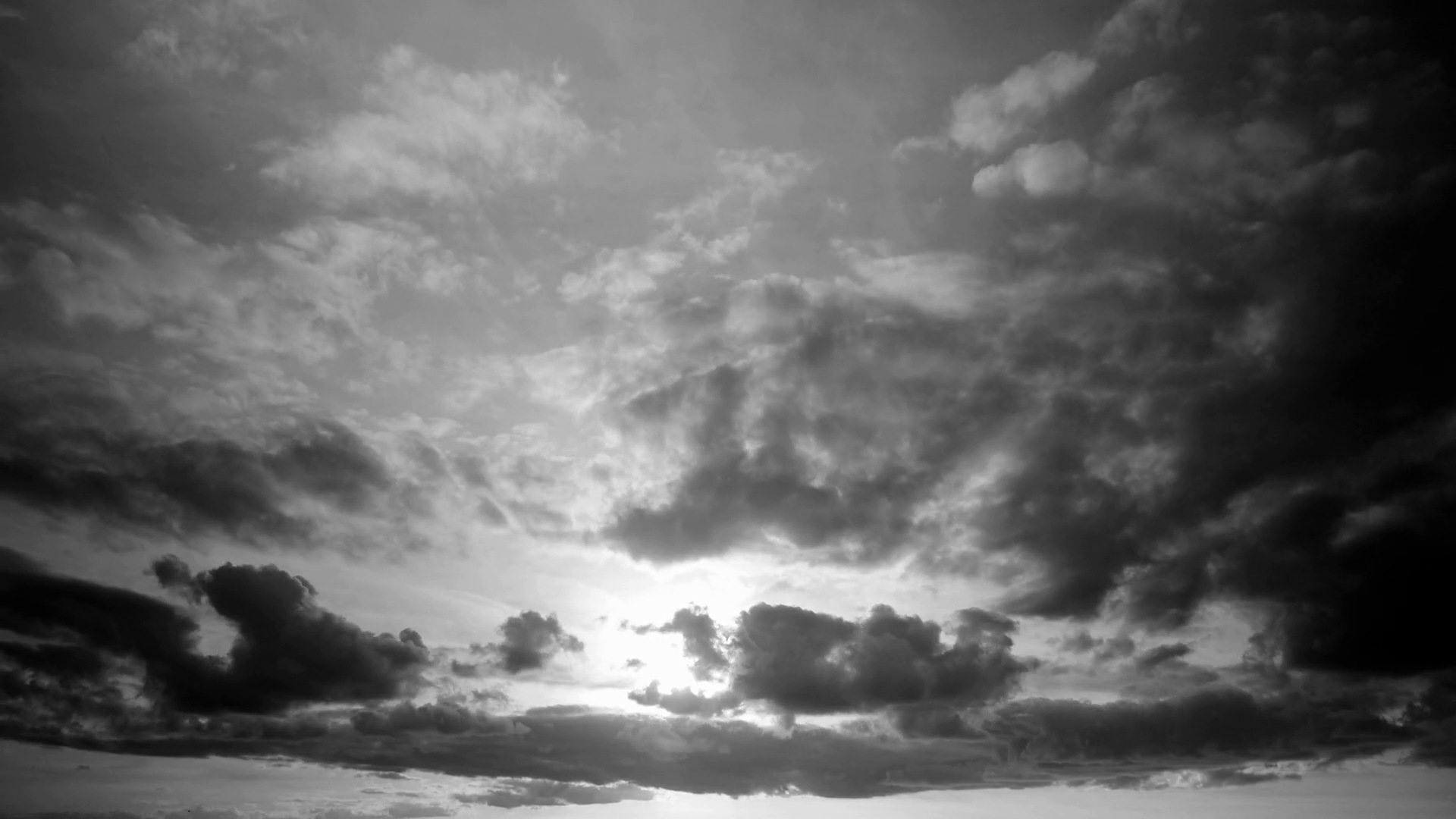 Timelapse of a cloudscape in black and white with dark clouds ...