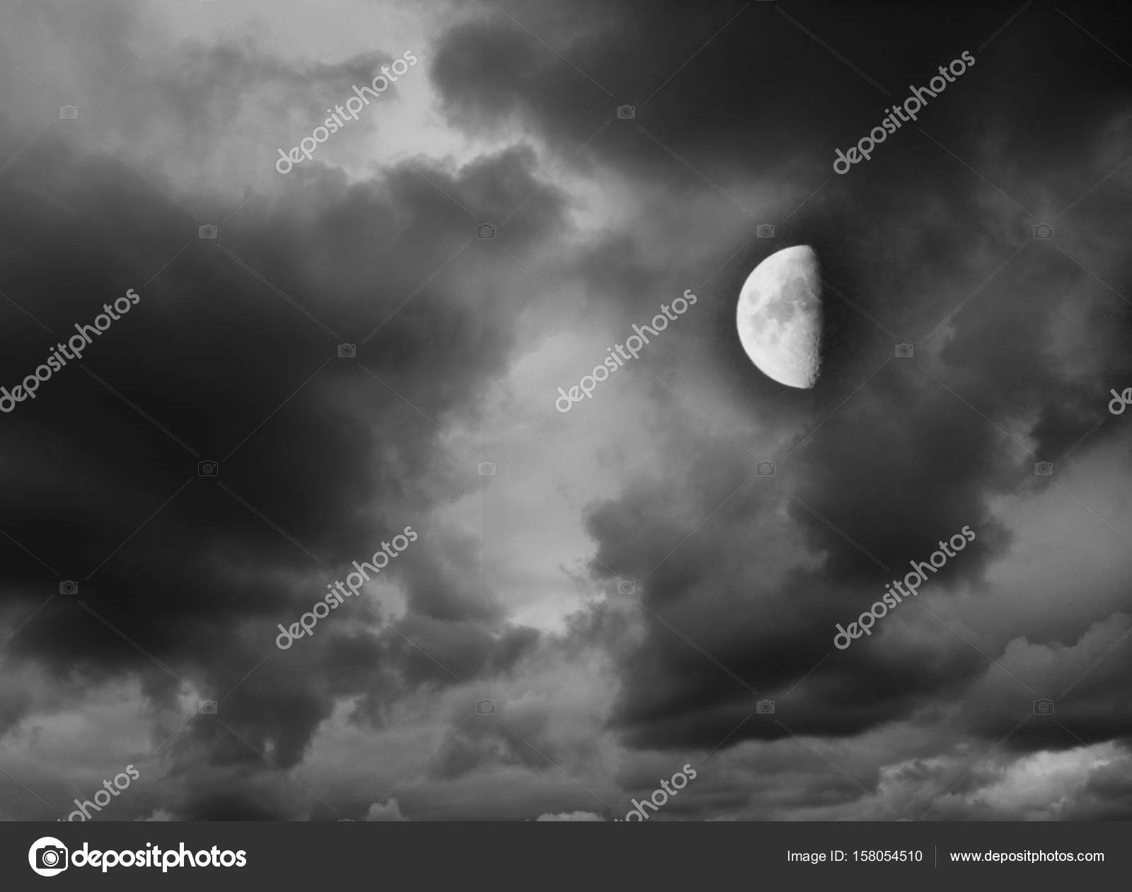 Moon in the dark cloudy sky — Stock Photo © alexmak72427 #158054510