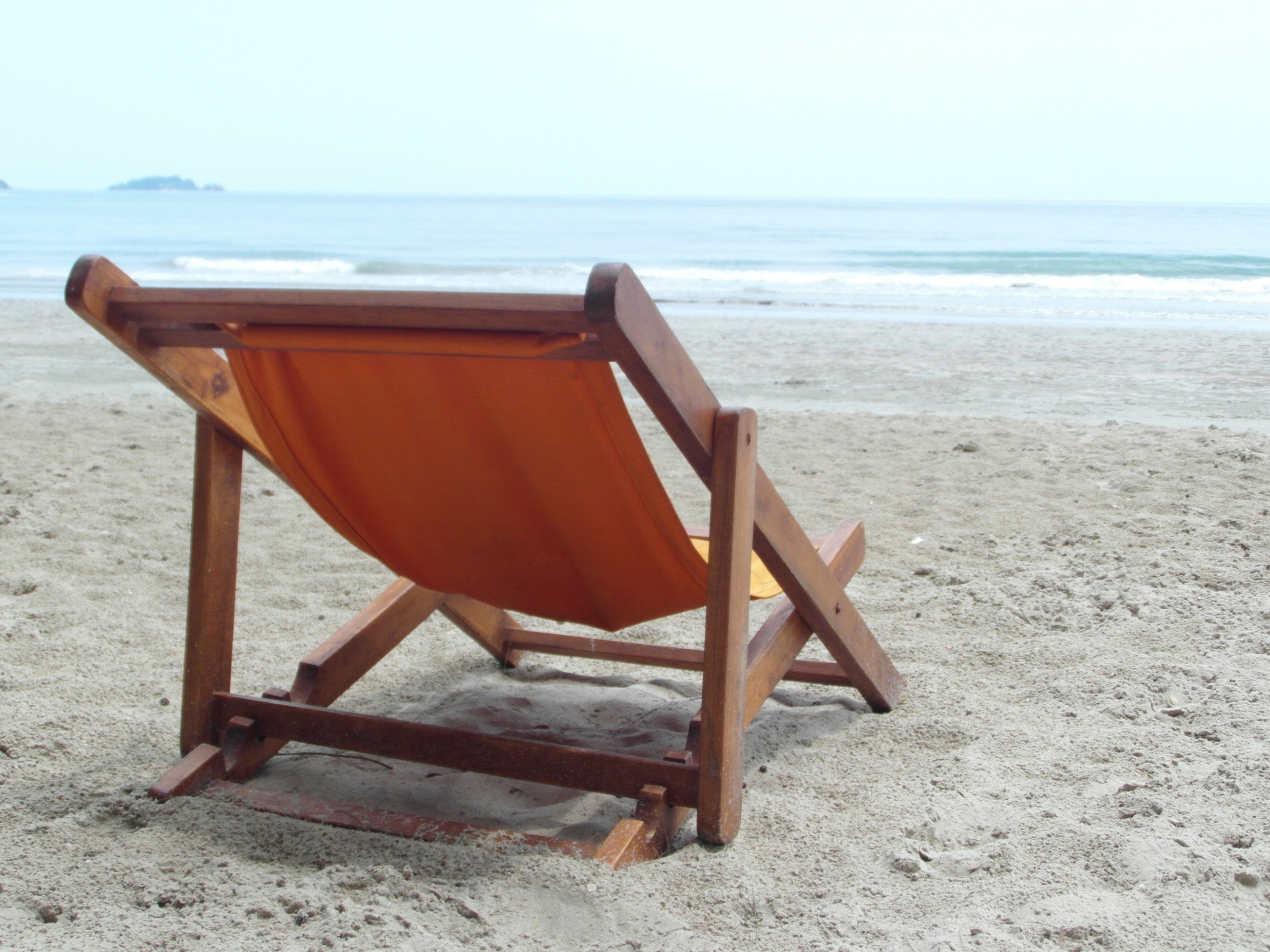 Deckchair on an empty beach photo