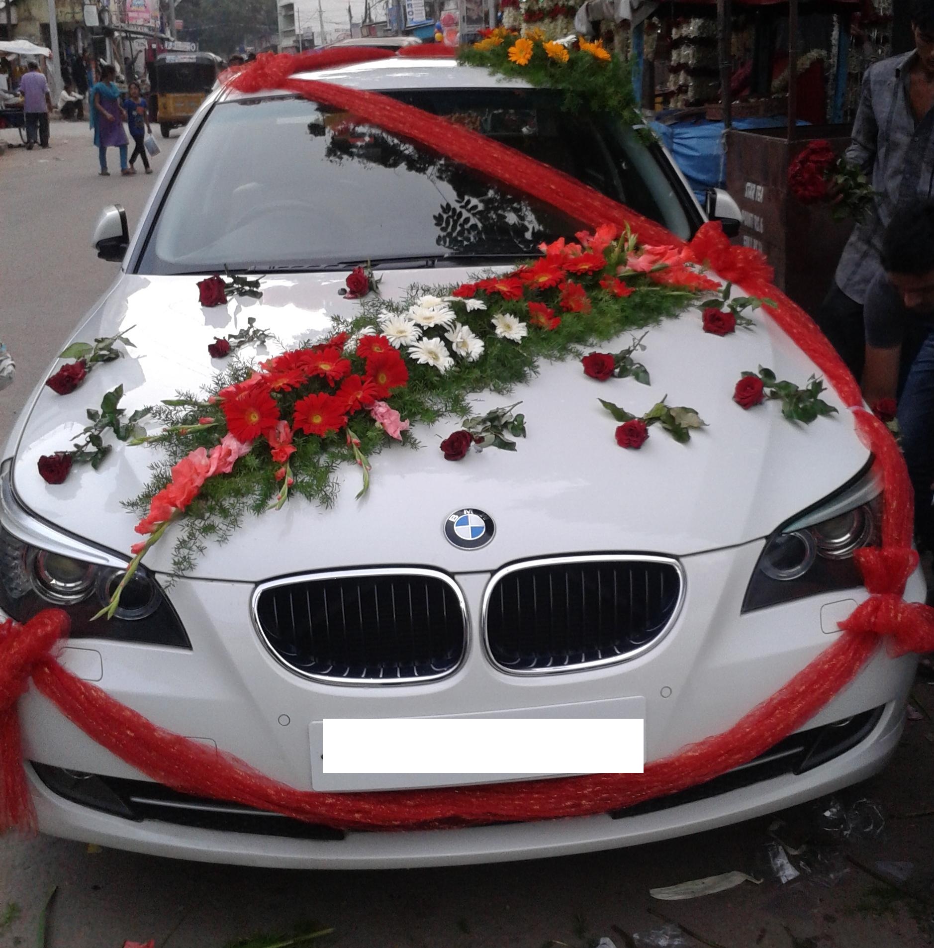 You can try car decoration for wedding with using red ribbon plus ...