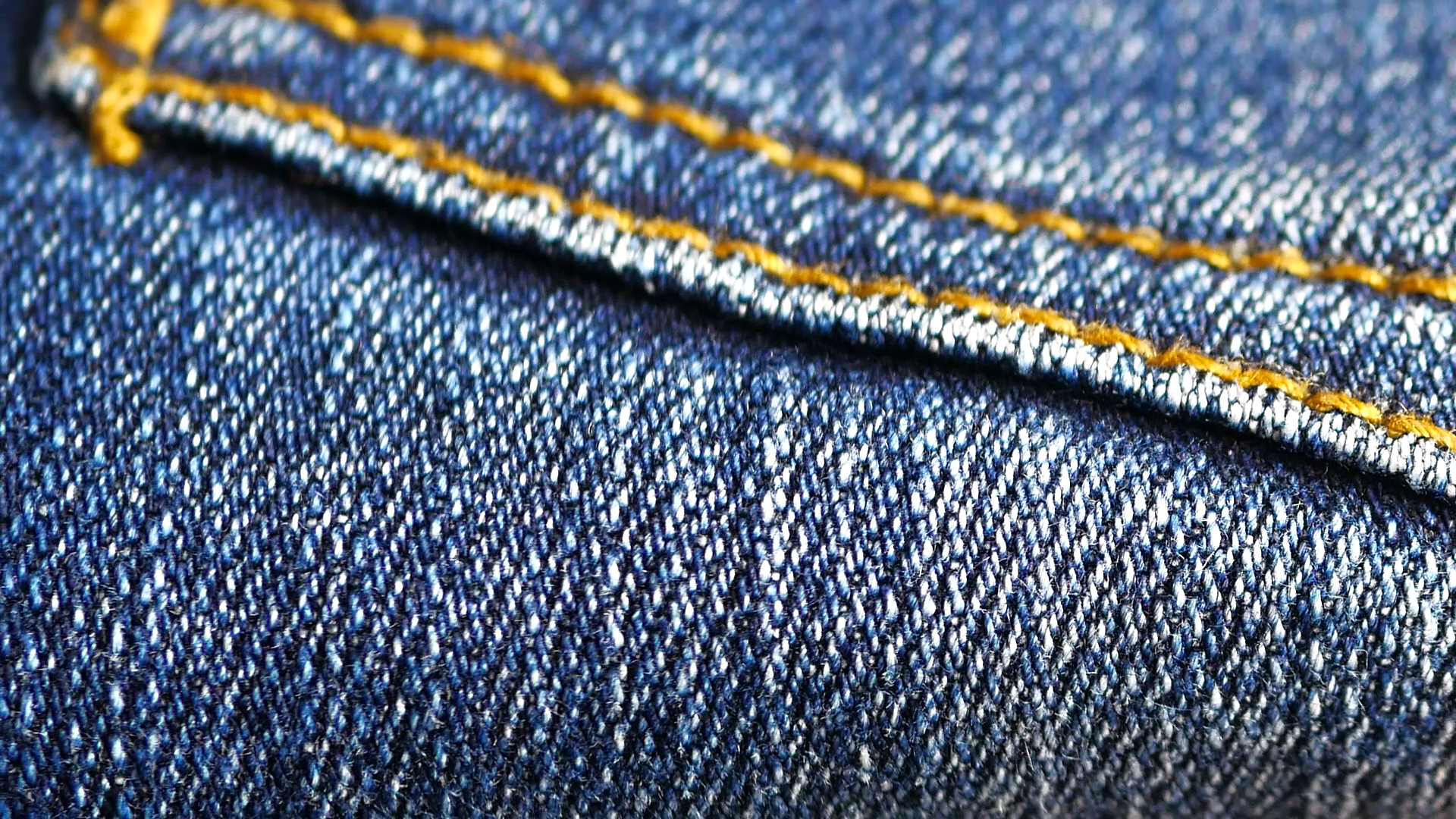 Blue denim jeans close up stock footage close up with a sliding ...