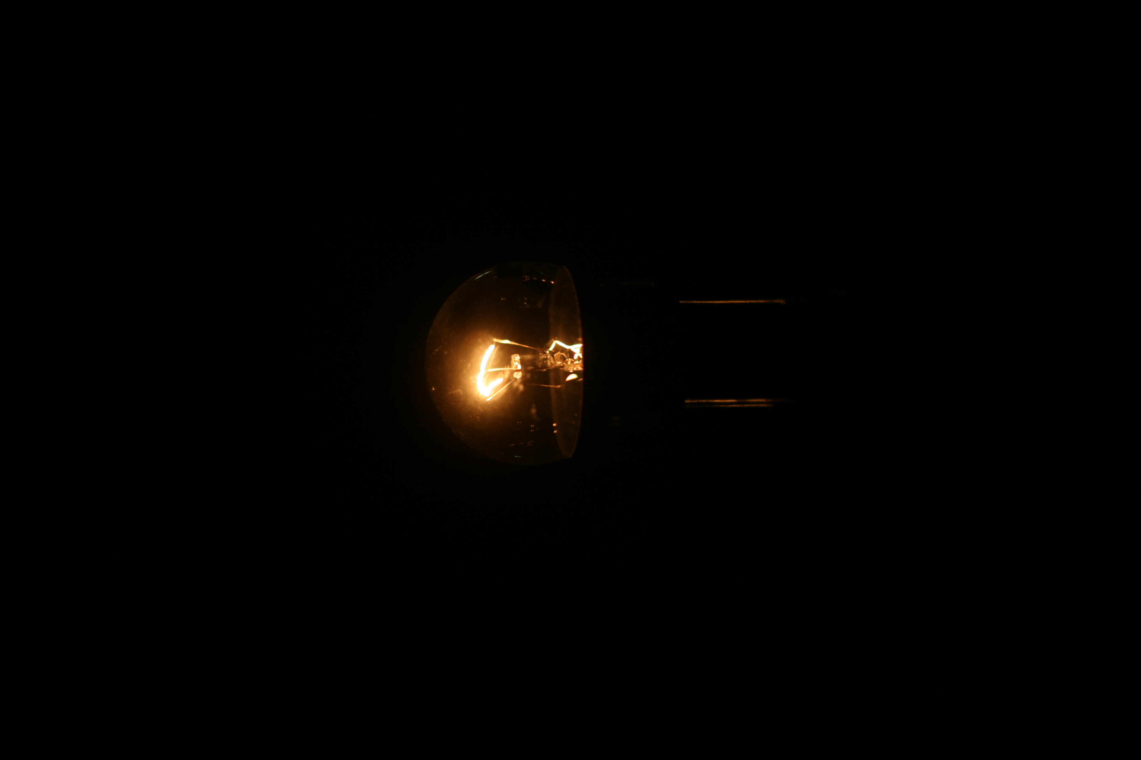 Dim light bulb at night | photo page - everystockphoto