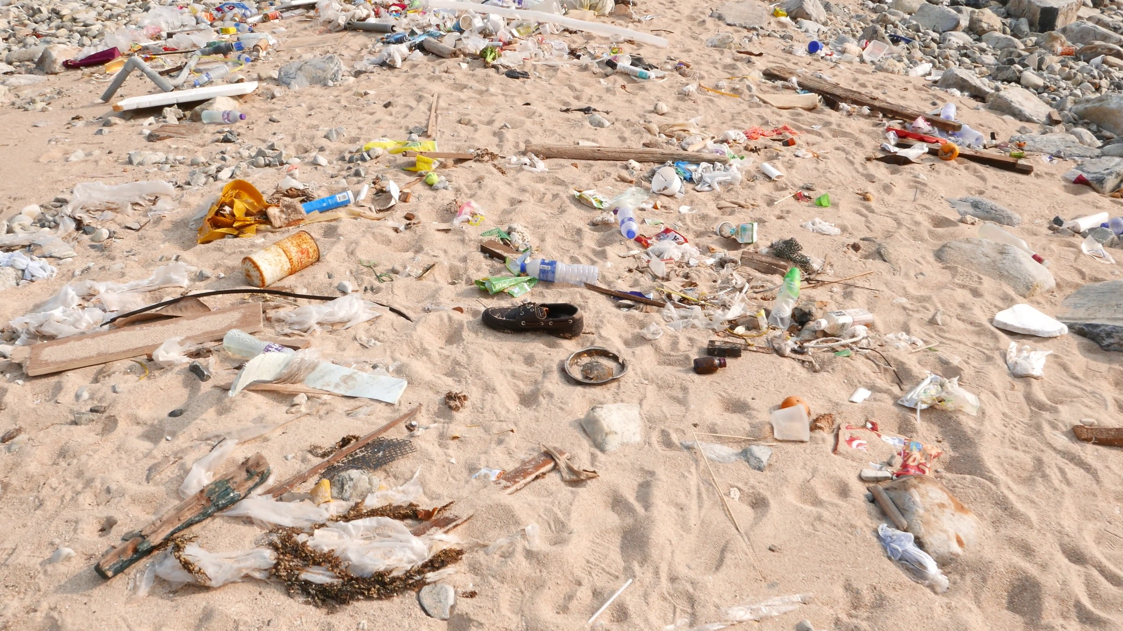 Debris on the very dirty beach, ecological problem, sea pan up many ...