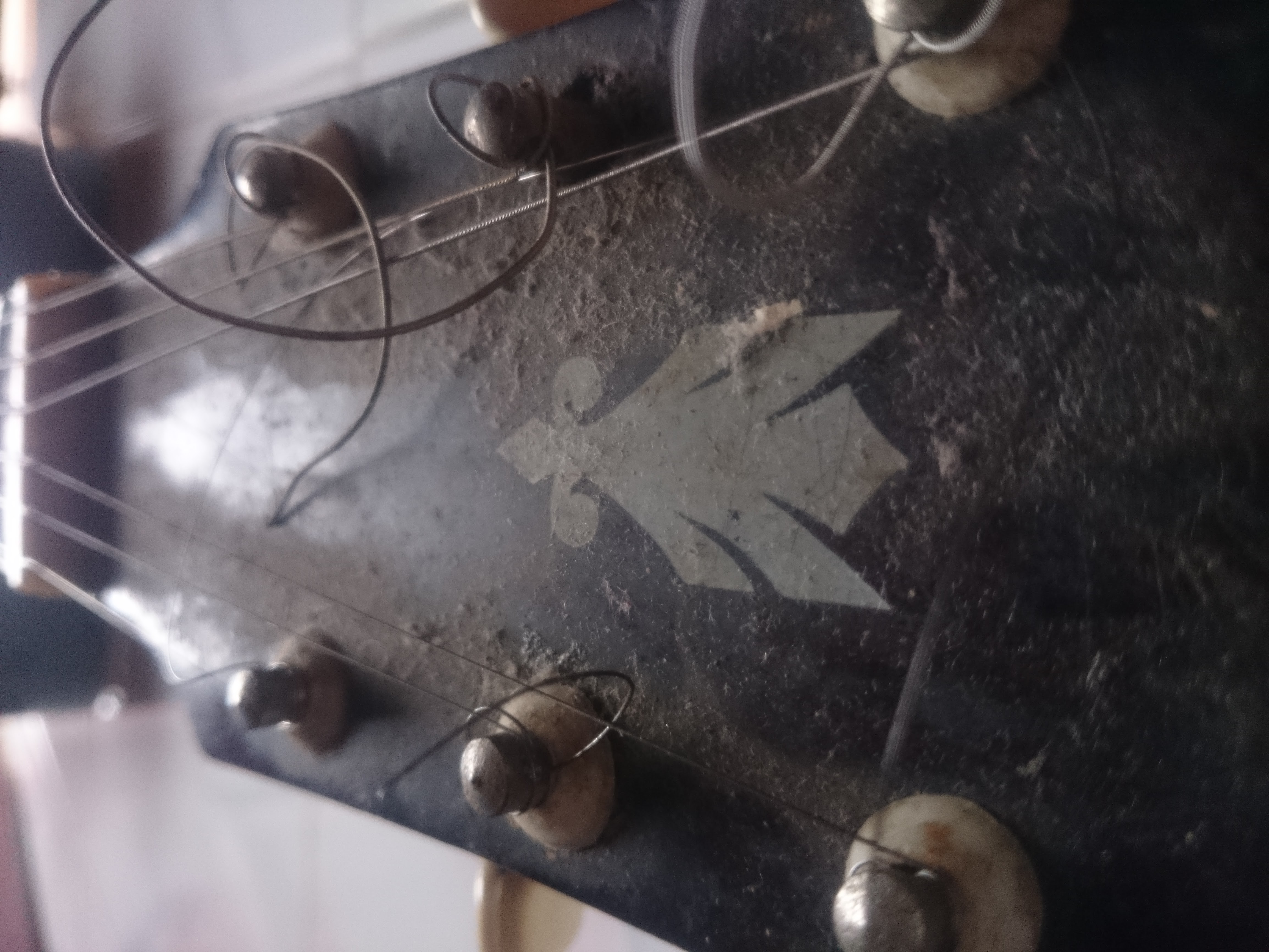 Dirty old guitar headstock photo
