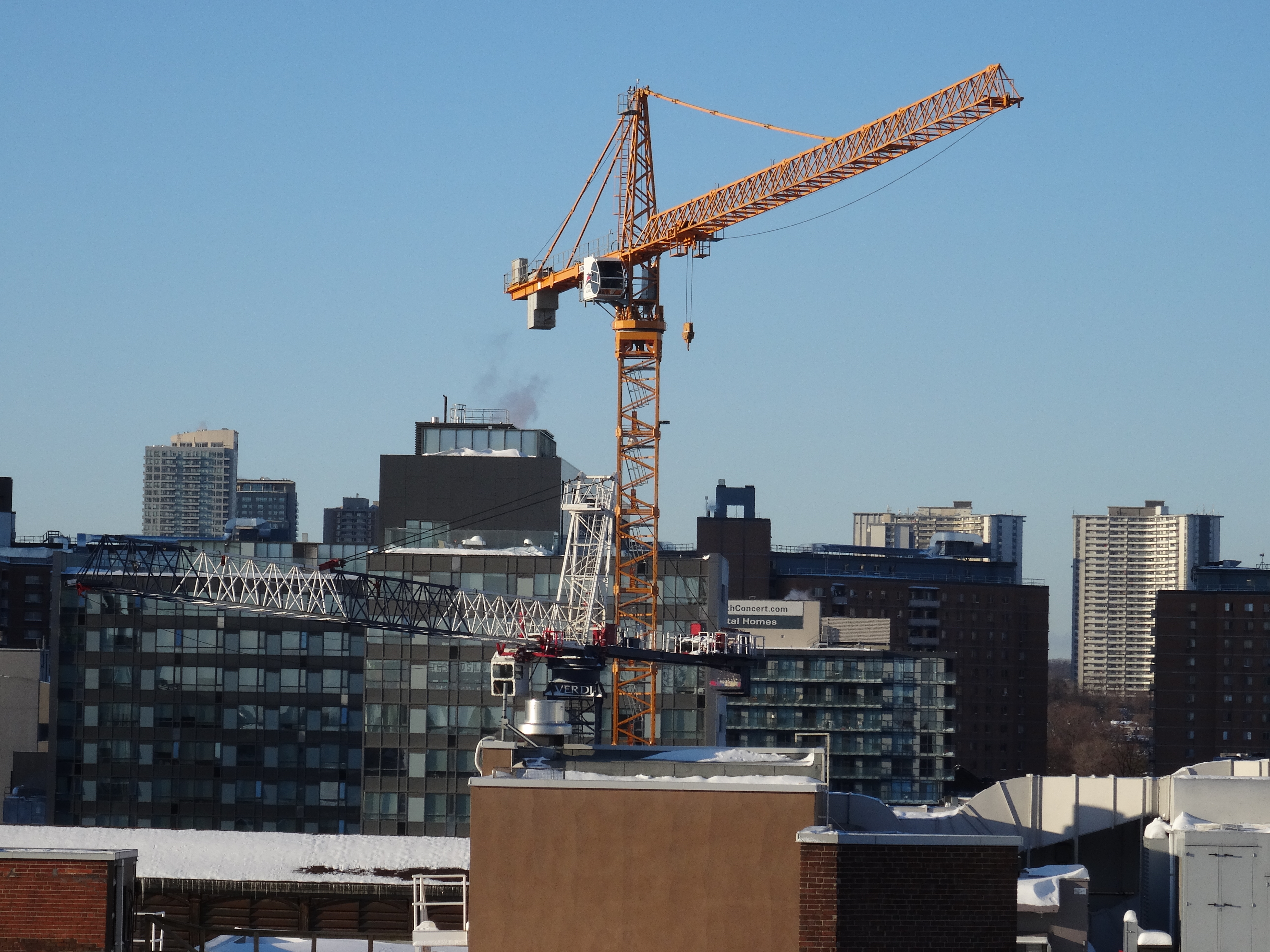 Distant construction cranes on toronto's skyline, 2015 02 02 (15) photo