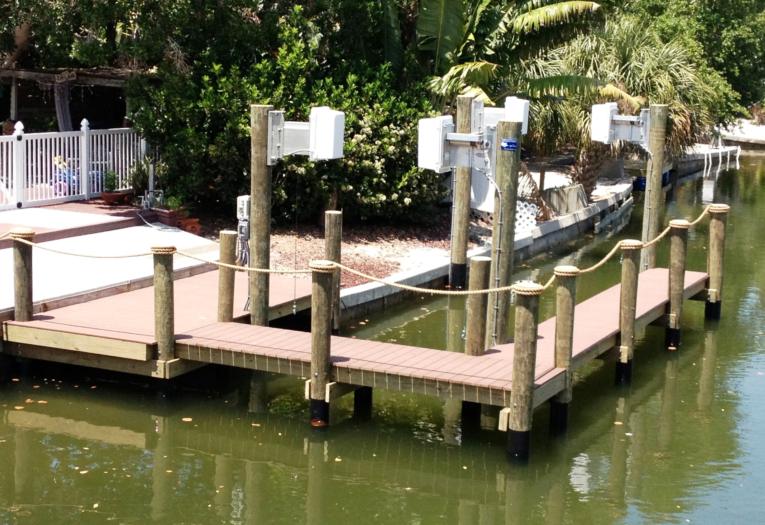 Manilla rope railing surrounding a dock | Boat Dock Accessories ...