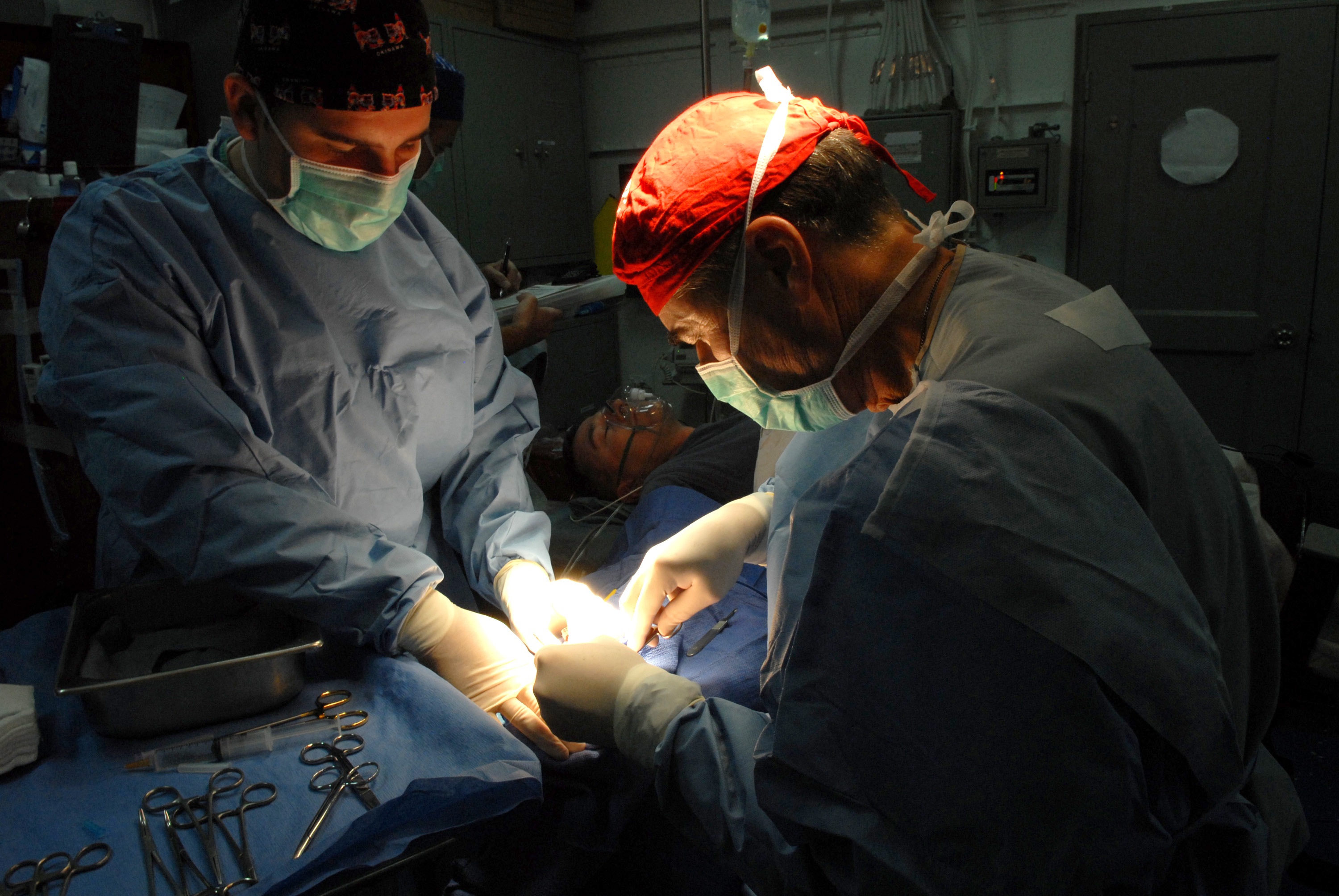 Doctors performing surgery photo