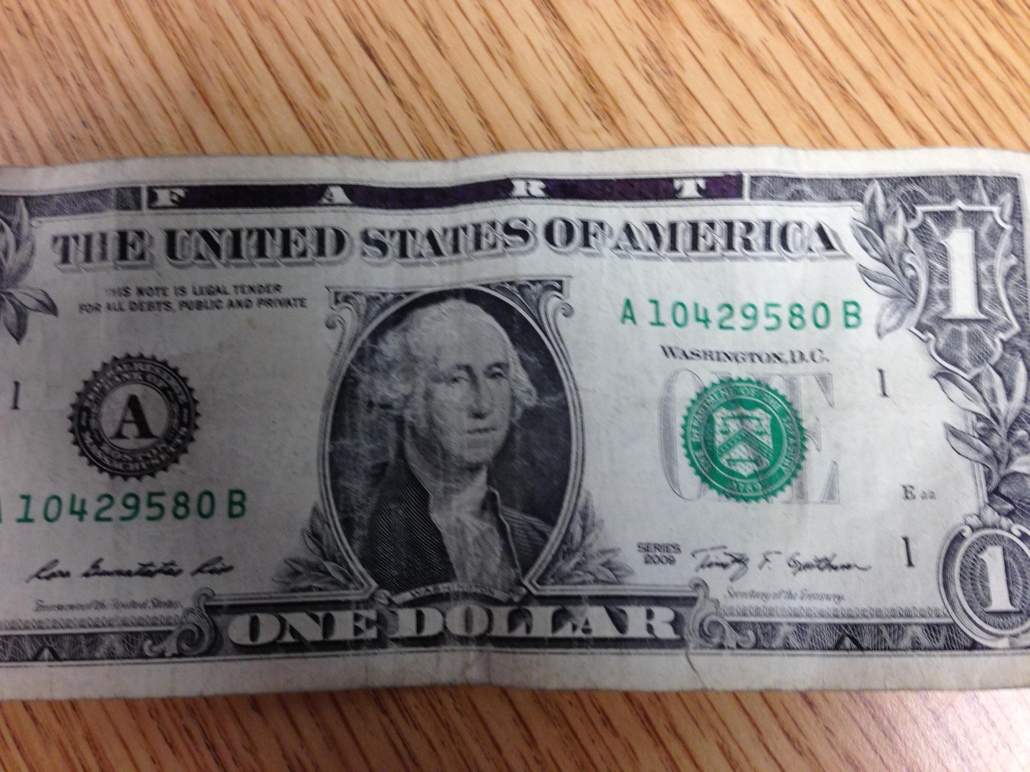 I was about to insert a dollar bill into the vending machine, when I ...