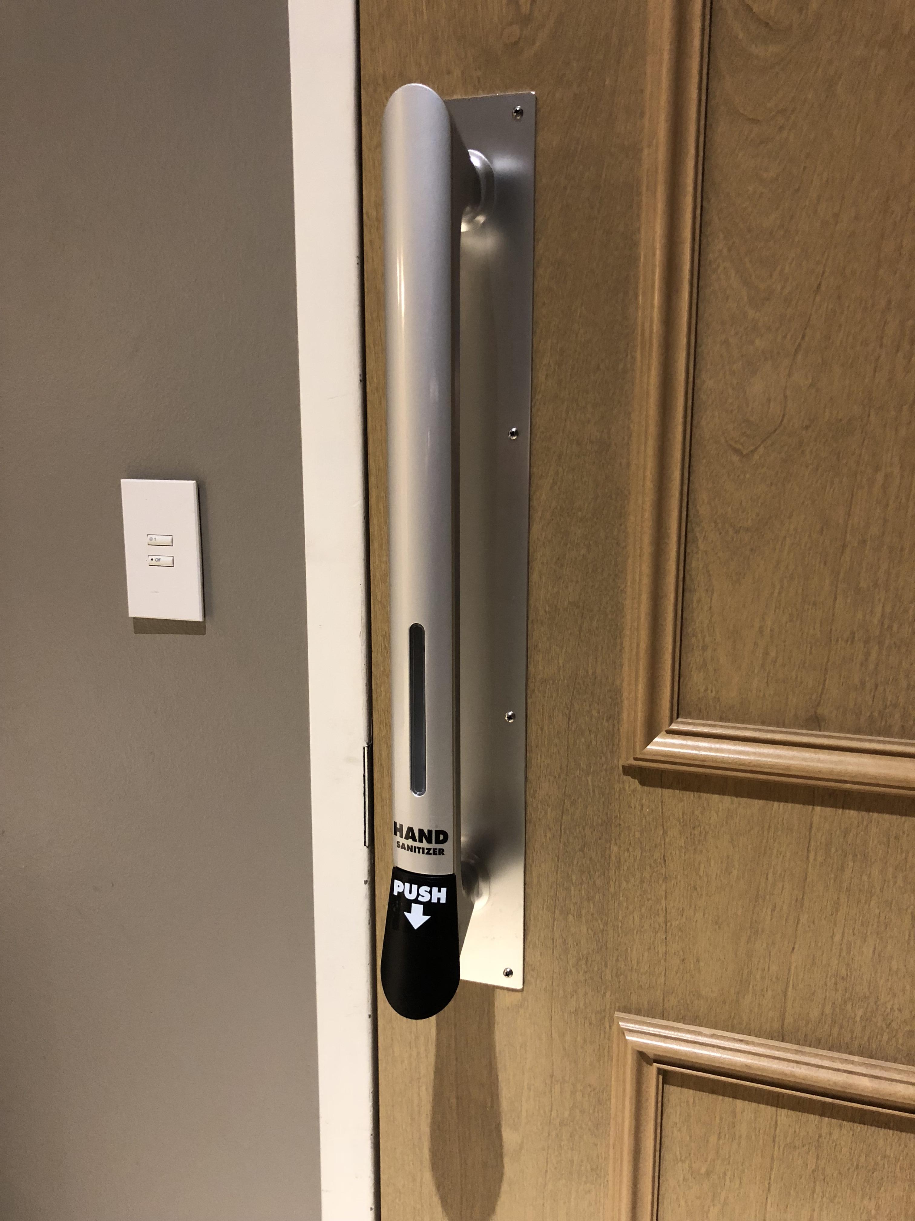 This bathroom door handle has a built-in hand sanitizer dispenser ...