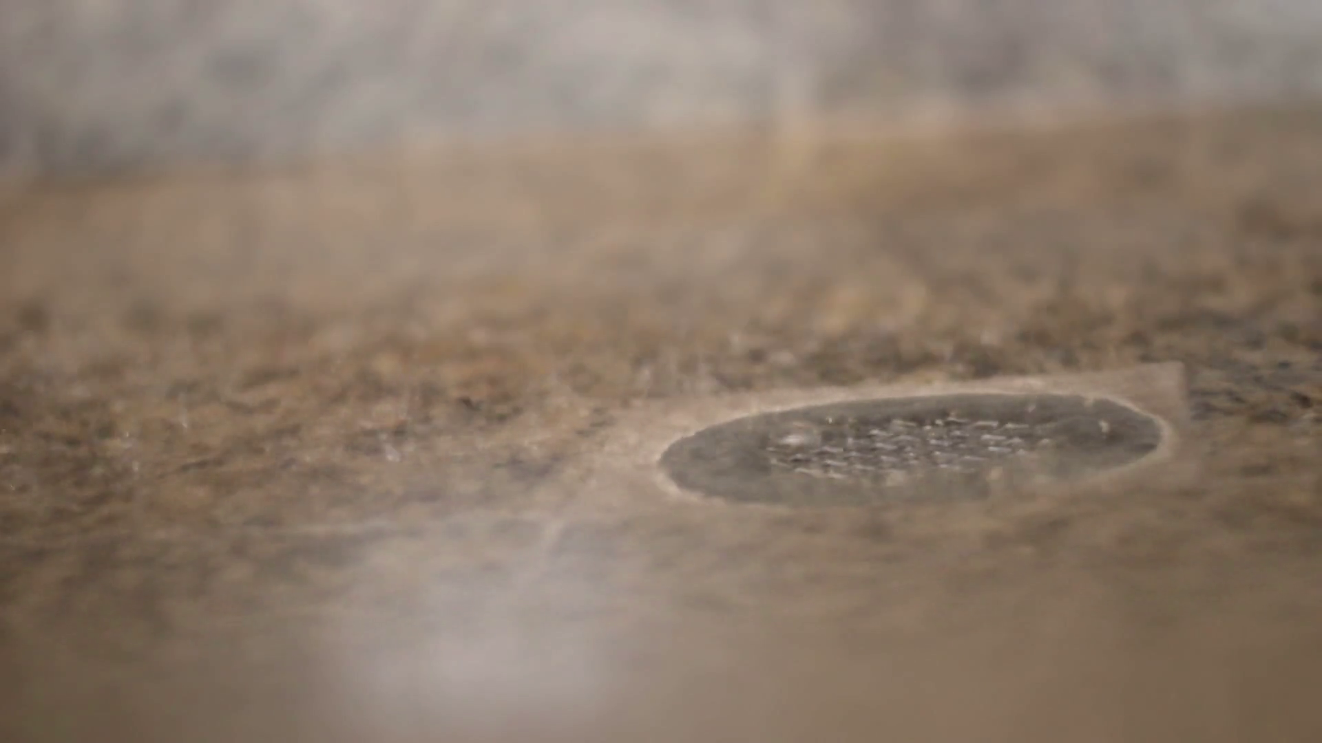 Close up of shower drain in modern bathroom with water droplets ...