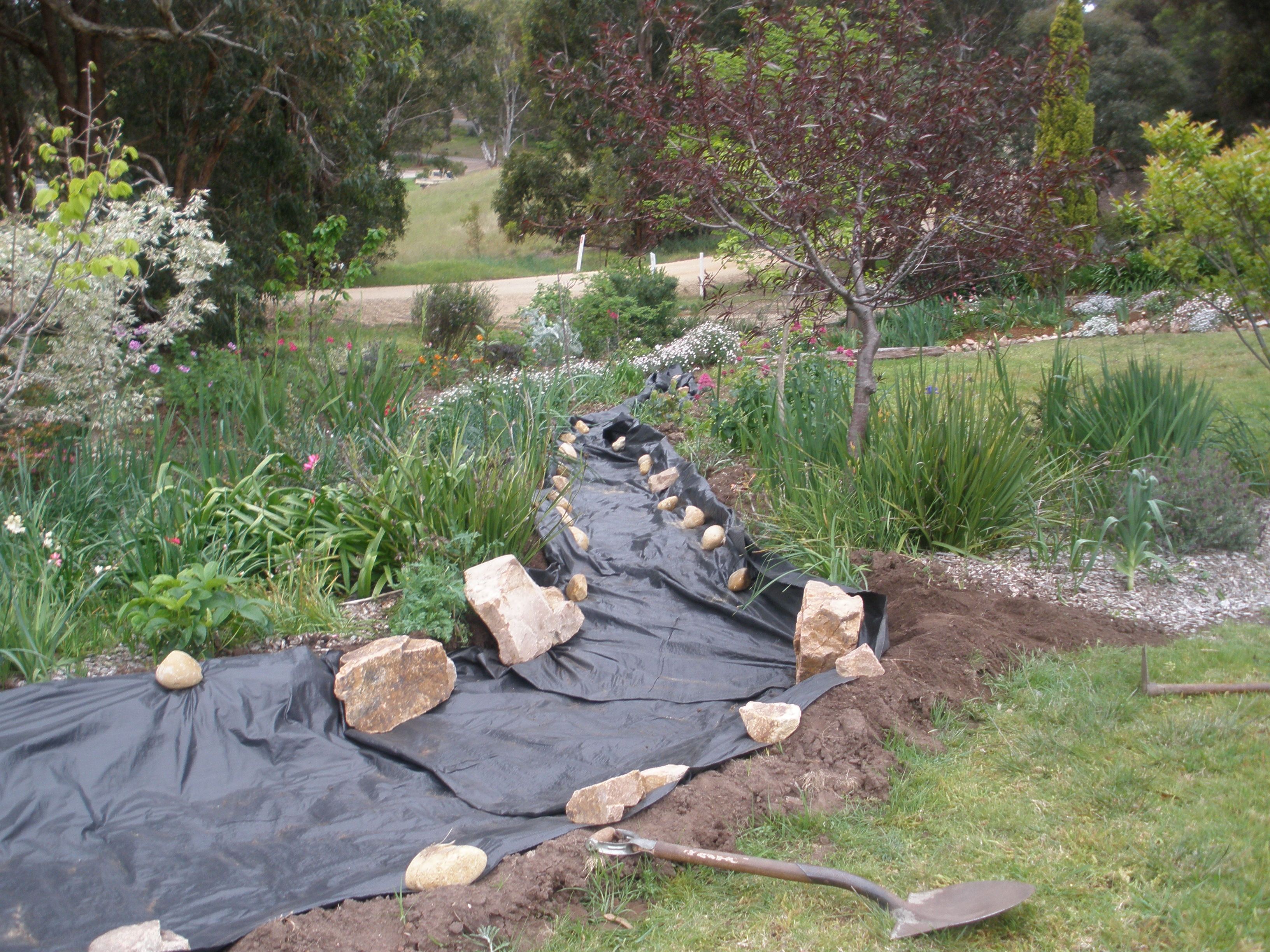 Building A Rock Garden Bed - Awesome Dry River Bed — LiveToManage.com