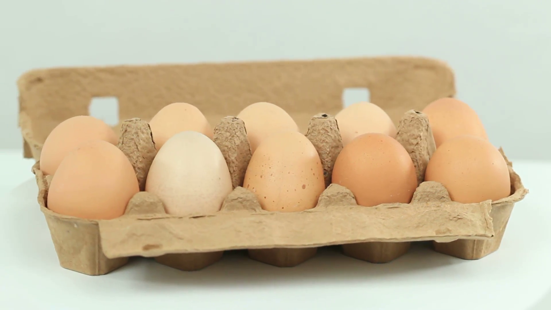 Egg Carton closeup shot - rotating chicken eggs Stock Video Footage ...
