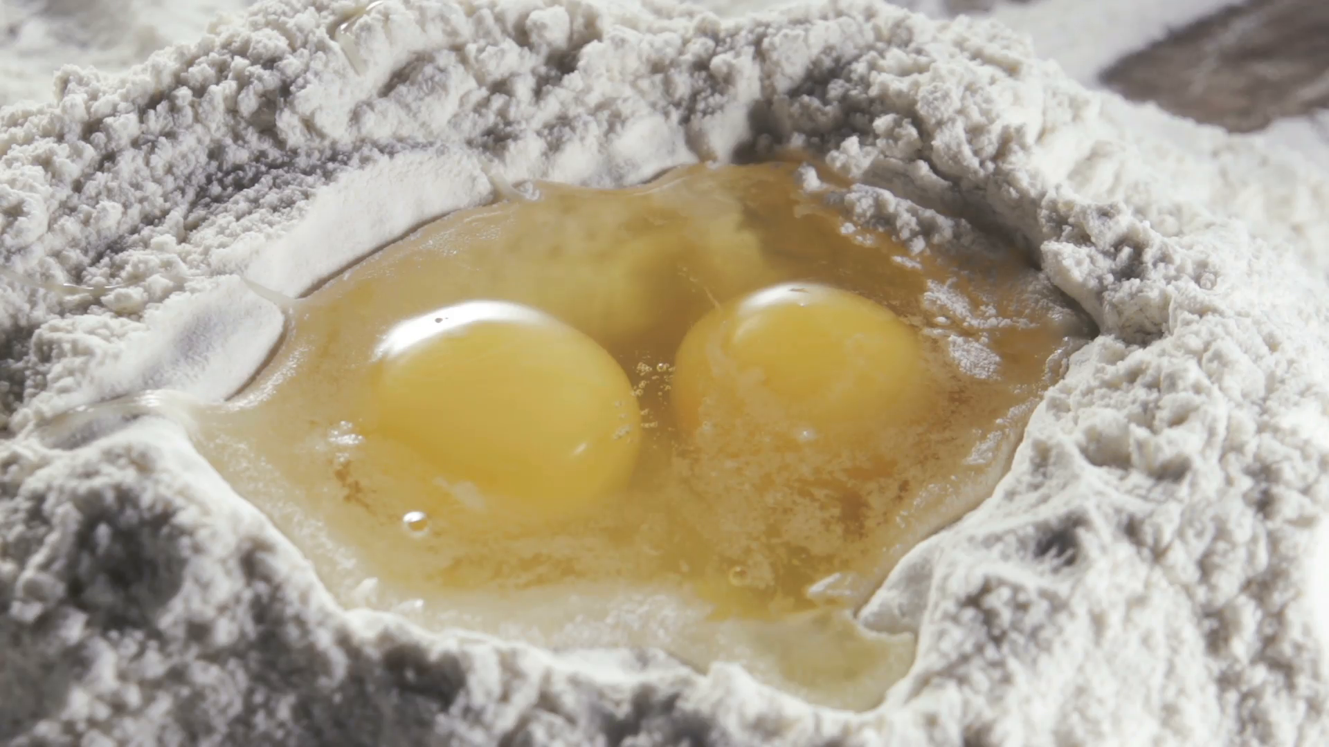 Two eggs in the middle of bleached wheat flour Stock Video Footage ...