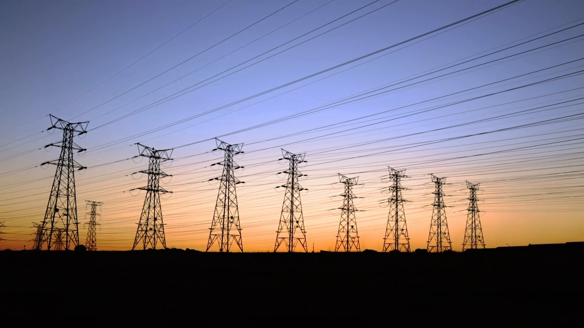 Pan of electrical power lines and pylons at dusk Stock Video Footage ...