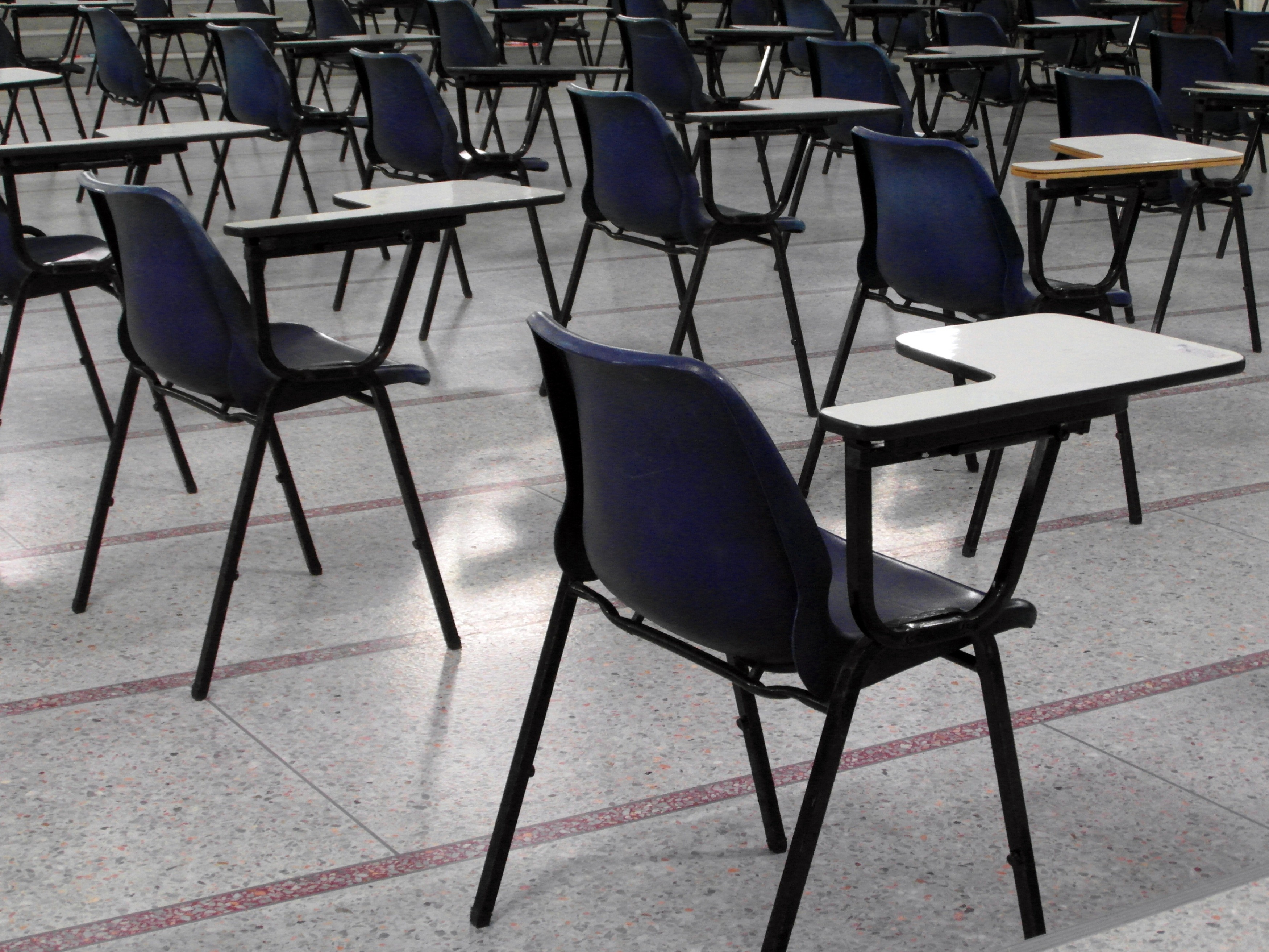 Empty exam hall and seats photo
