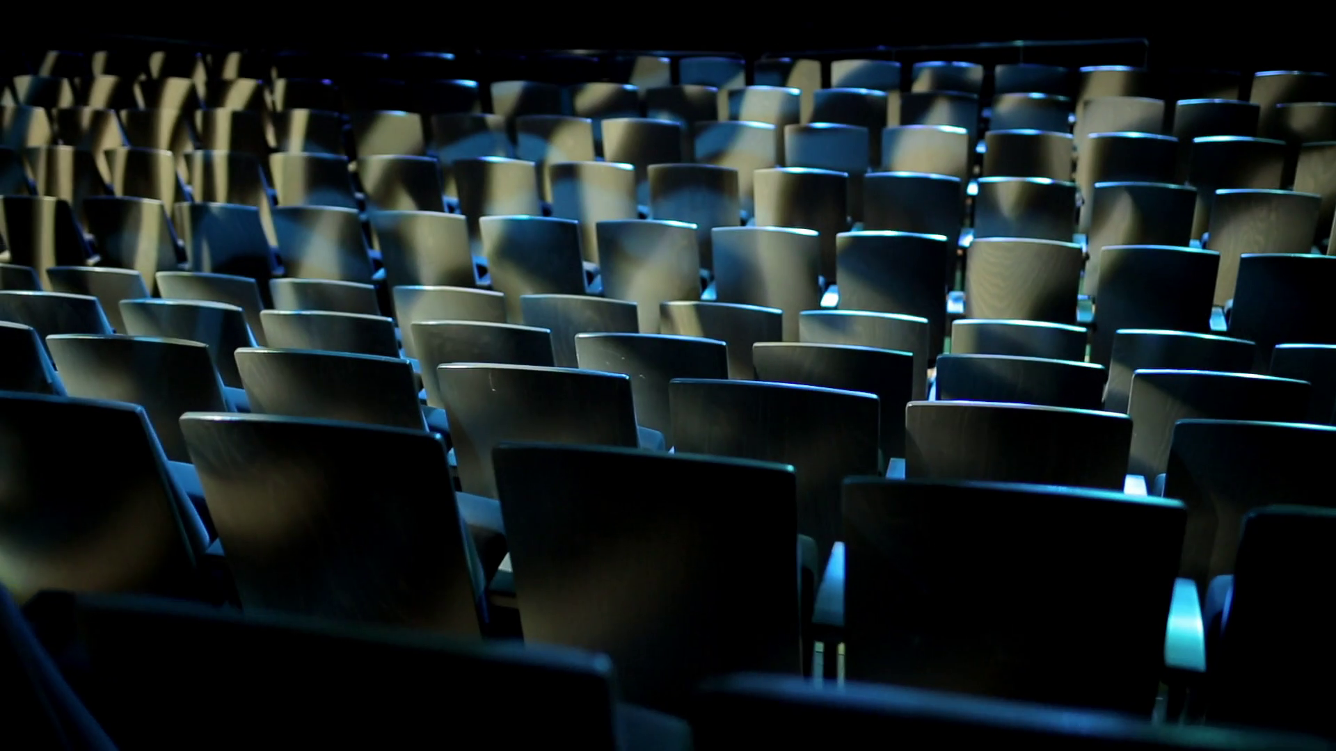 Empty theater auditorium or cinema with dark blue or black seats ...