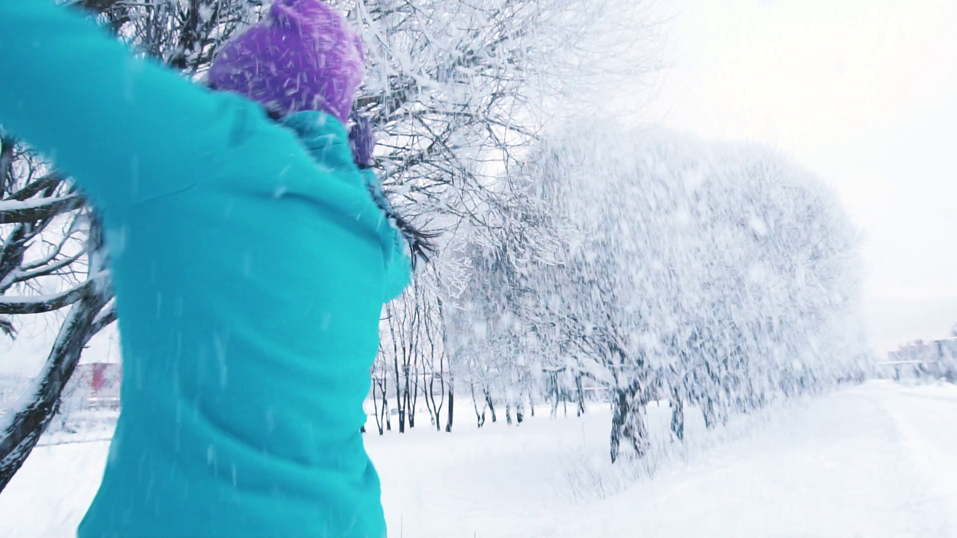smiling girl enjoying snowfall in winter in park Stock Video Footage ...