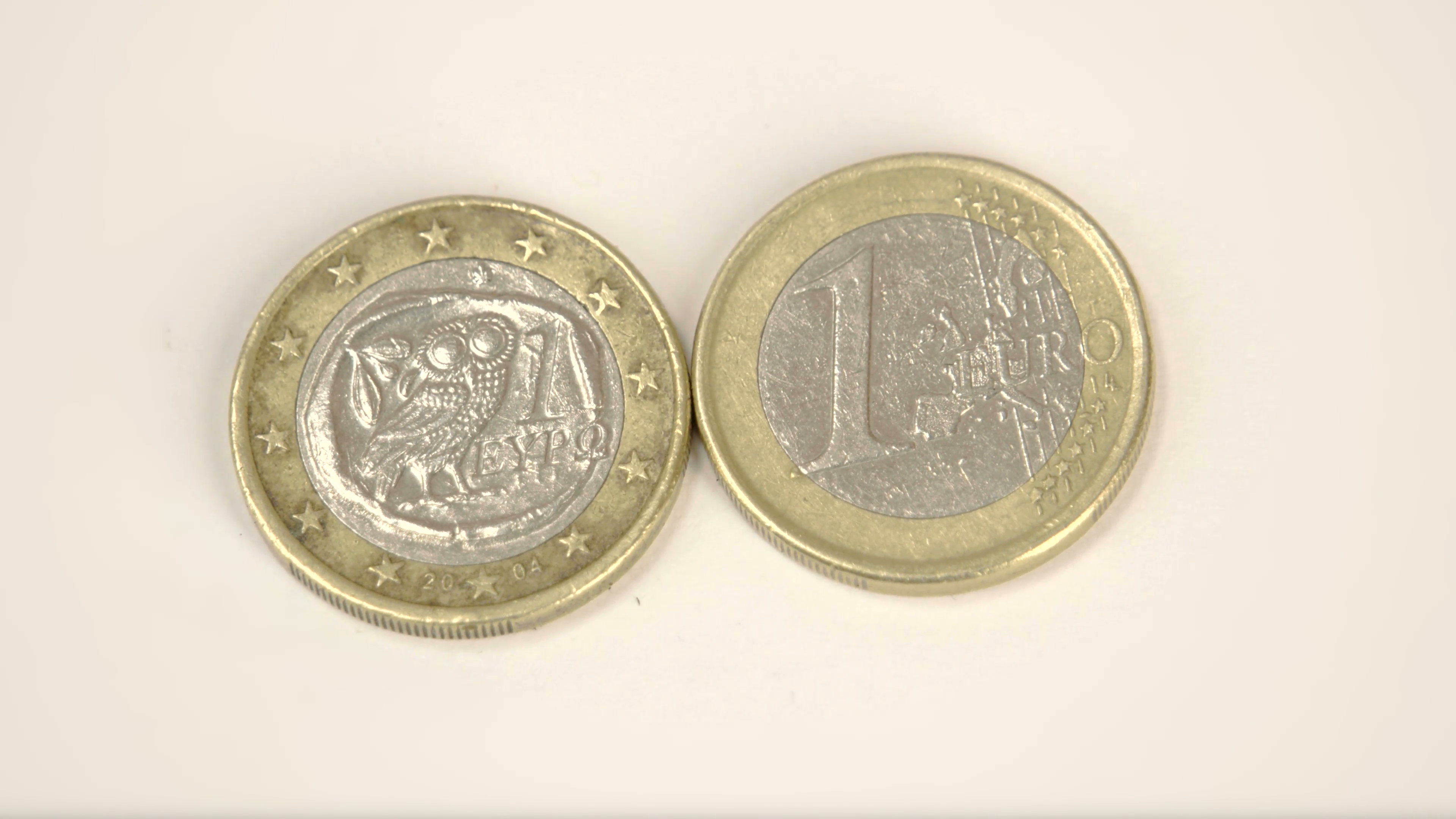 Two 1 Greece Euro coins on the table Stock Video Footage - Videoblocks