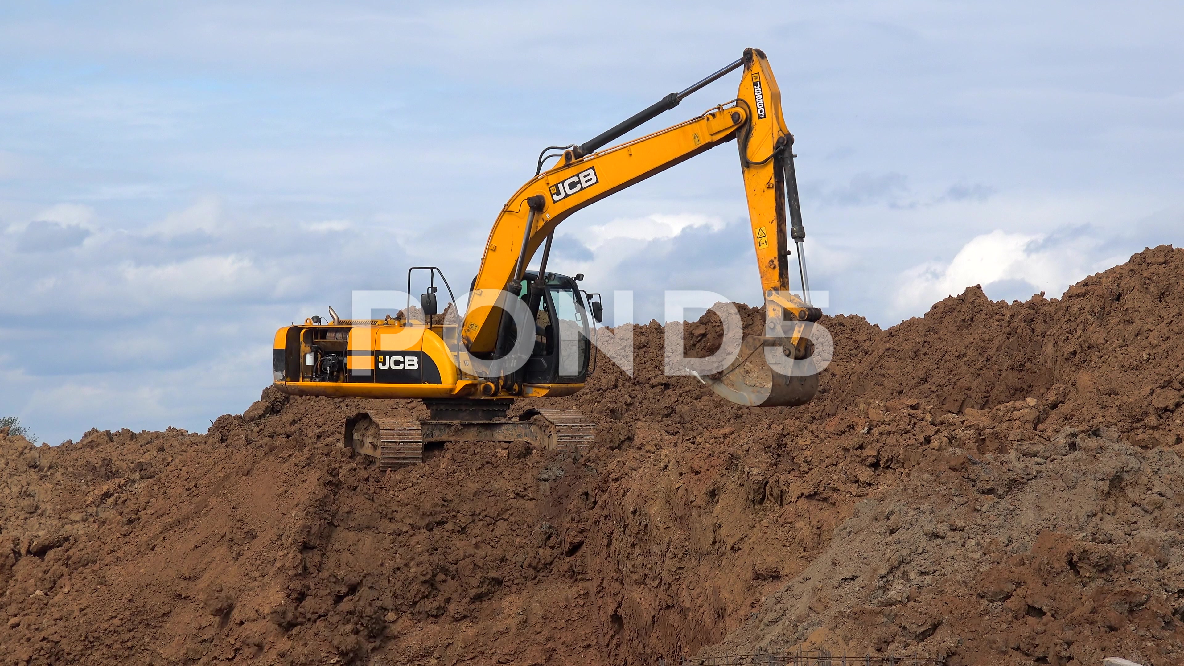 Work Excavator at a construction site. ~ Footage #66909318
