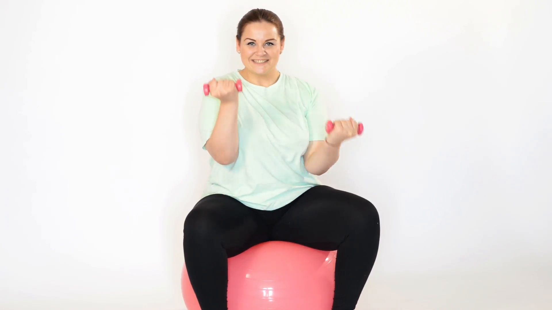 Fat woman making exercises with dumbbells on a fitness ball isolated ...