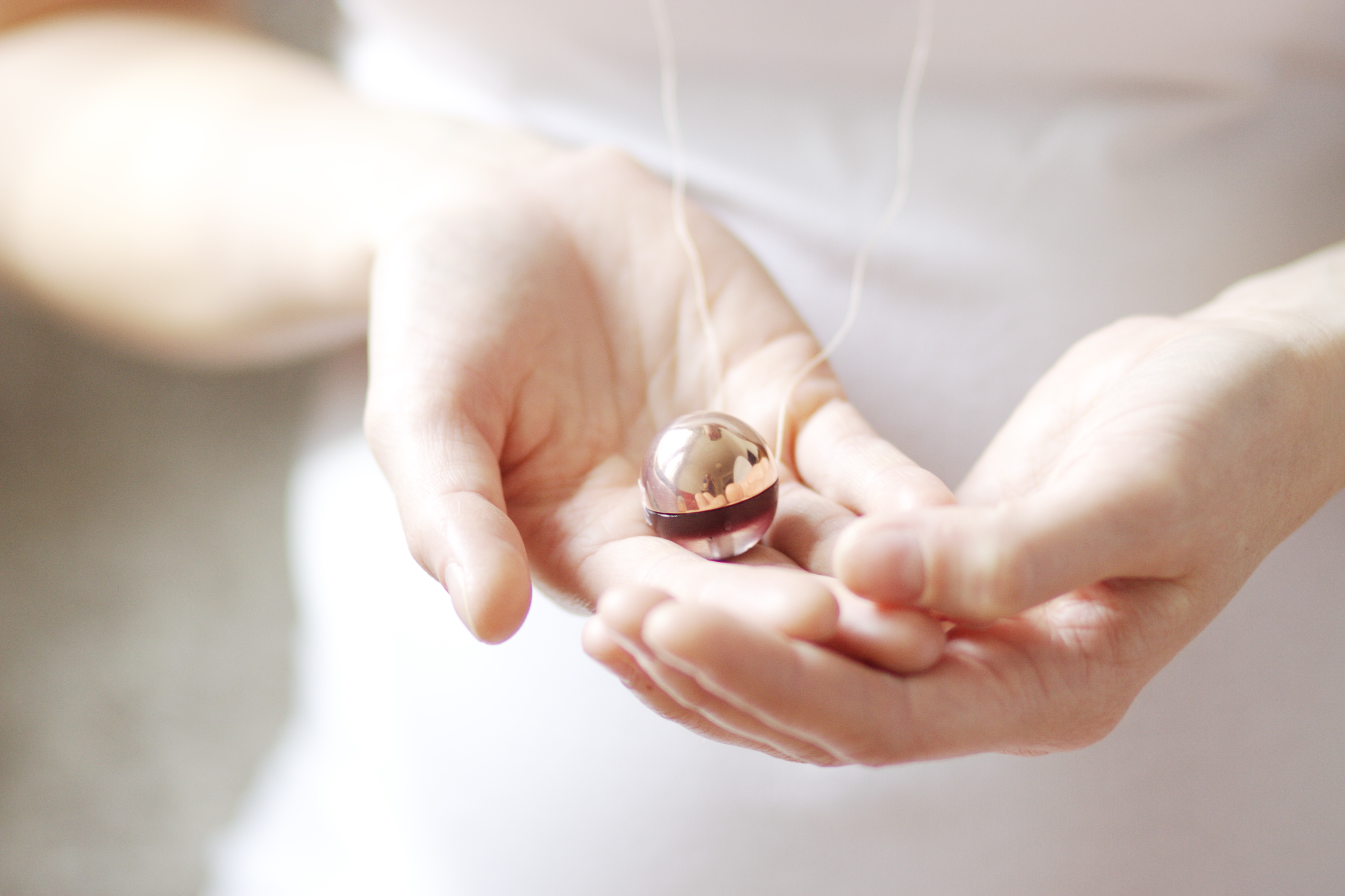 Lullaball necklace is designed to bring a soft chiming sound to ...