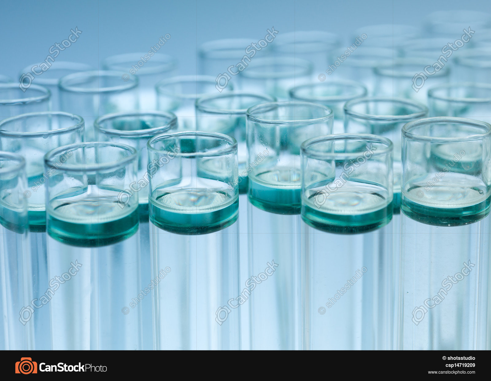 Cluster of filled experimental test tubes. Light blue... stock ...