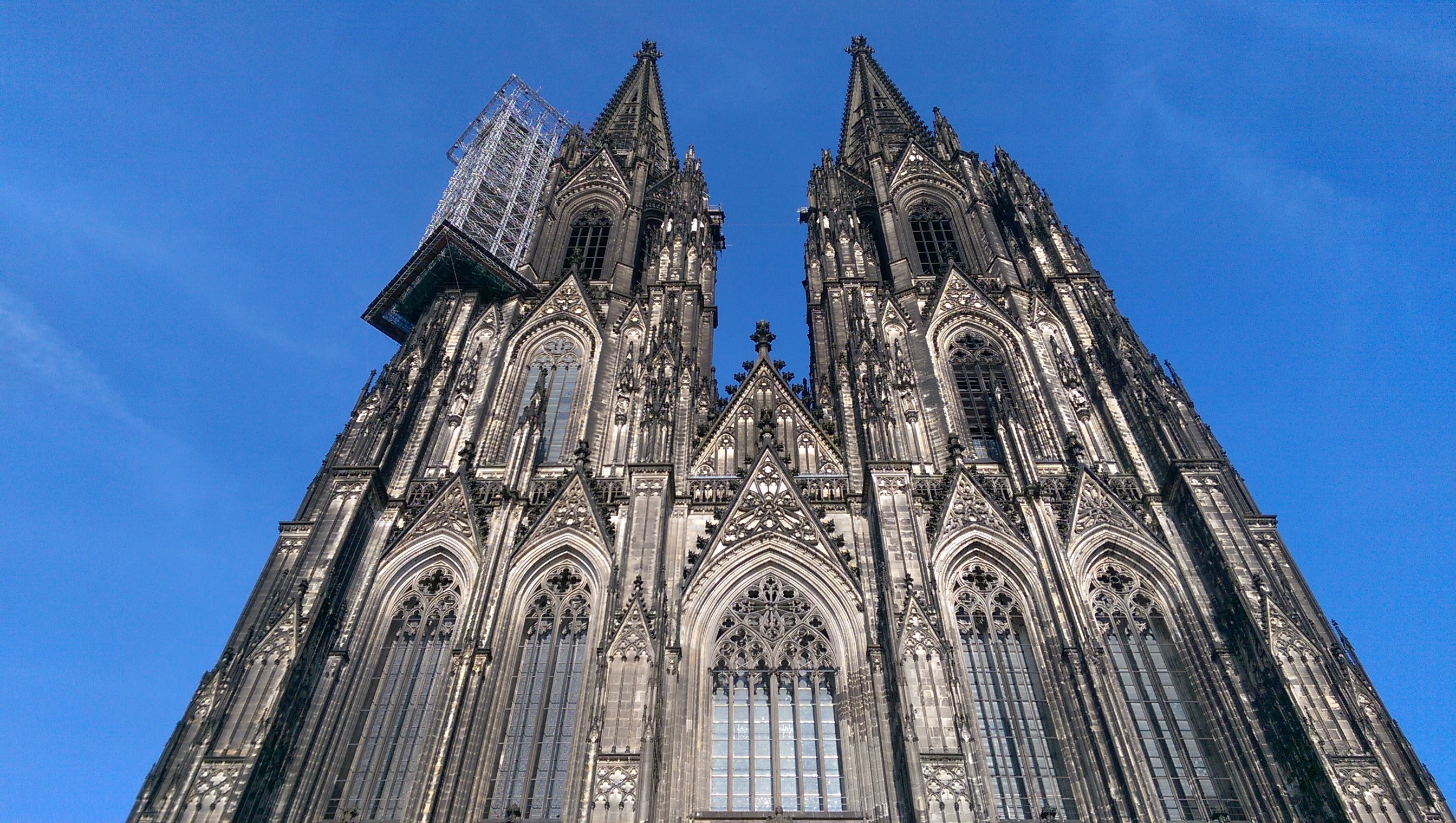 Facade of cathedral against blue sky photo