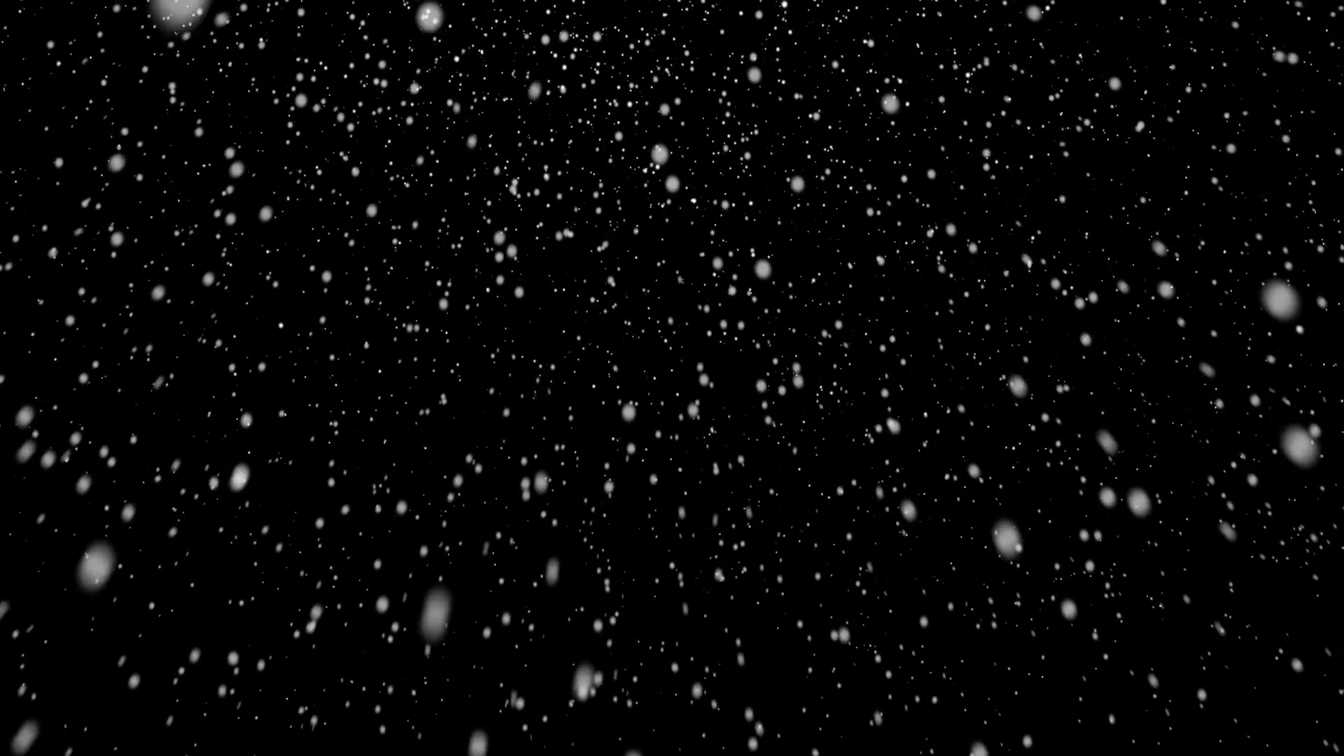 Gently falling snow over a black backdrop. Winter Holidays ...