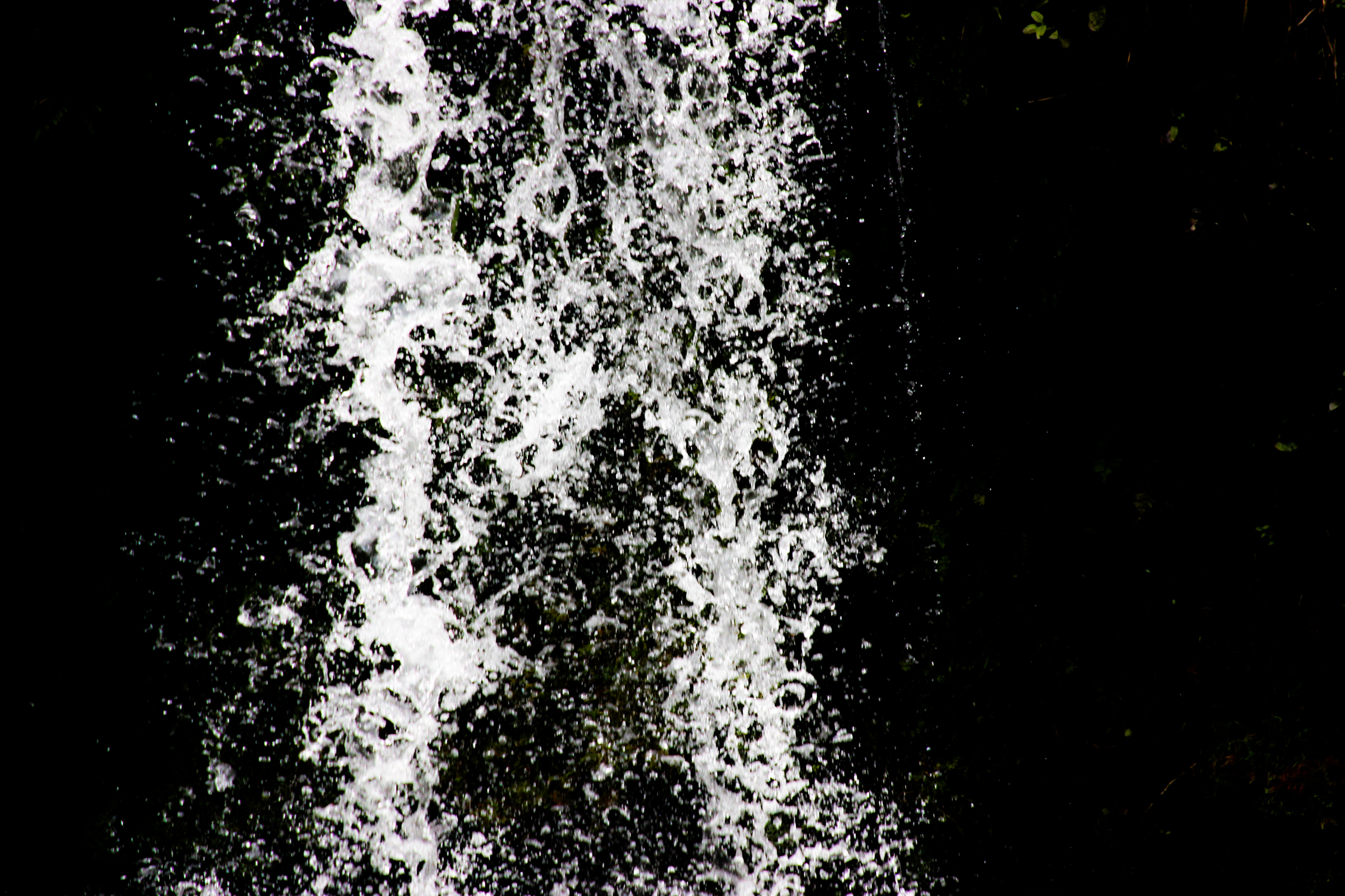 Free Stock Photo of Water Falling Against Black Background