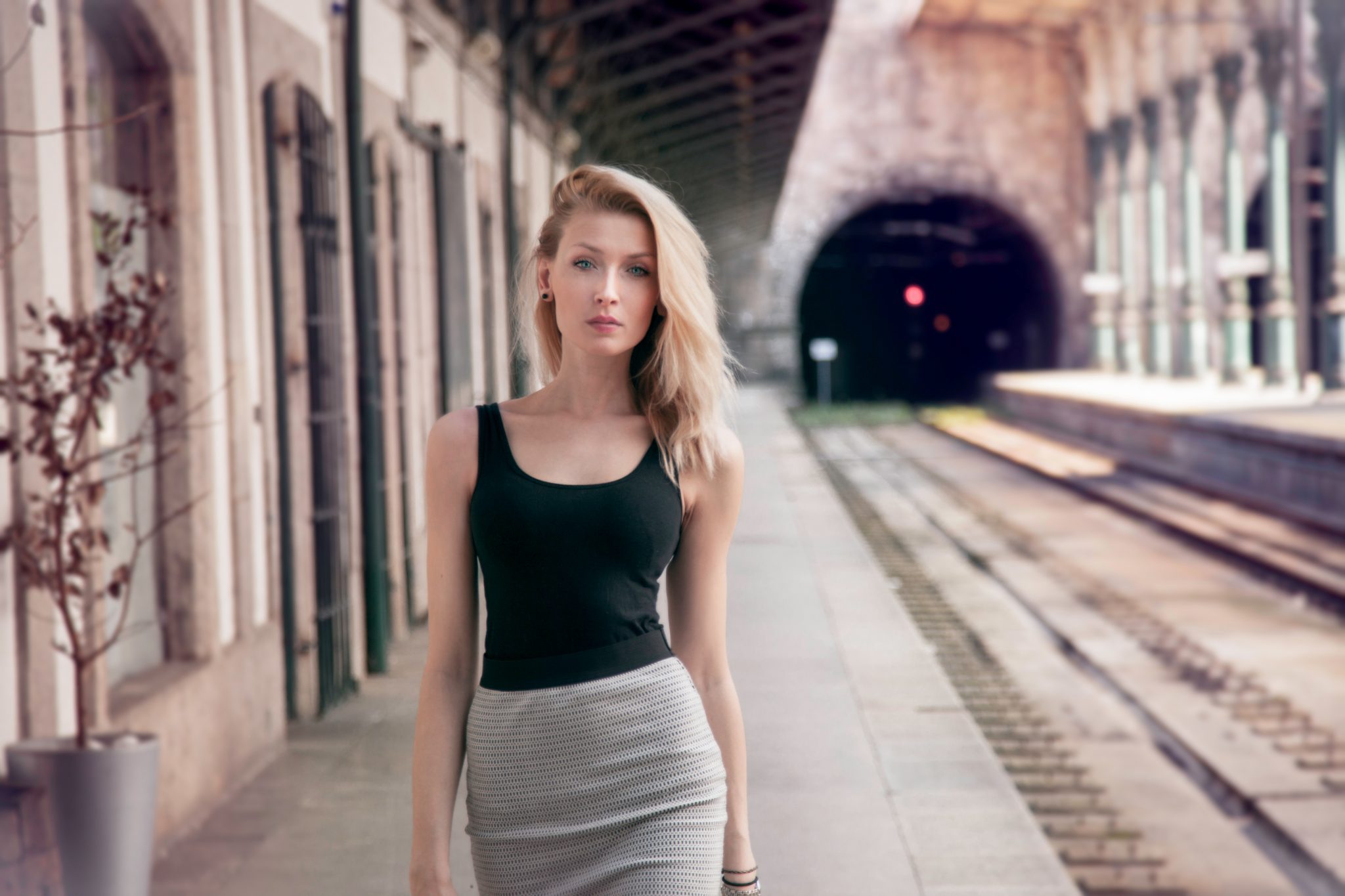 Fashionable girl posing on railway. - The Word Sprite