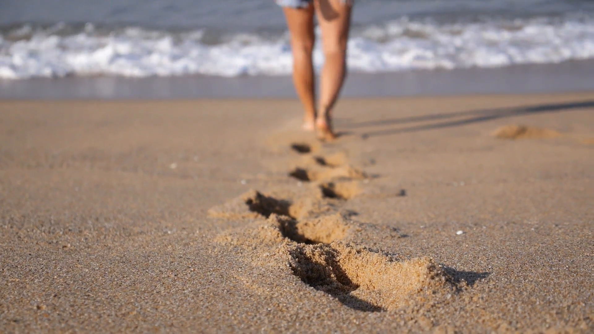 Female Feet Leaving Footprints in Sand Walking on Beach Stock Video ...