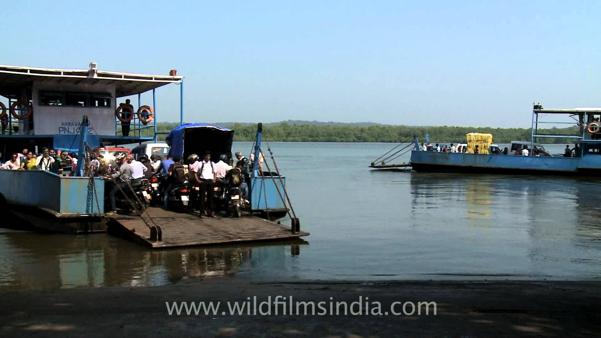 Taking Bikes and cars on Ferries across Mapusa River at Penha de ...