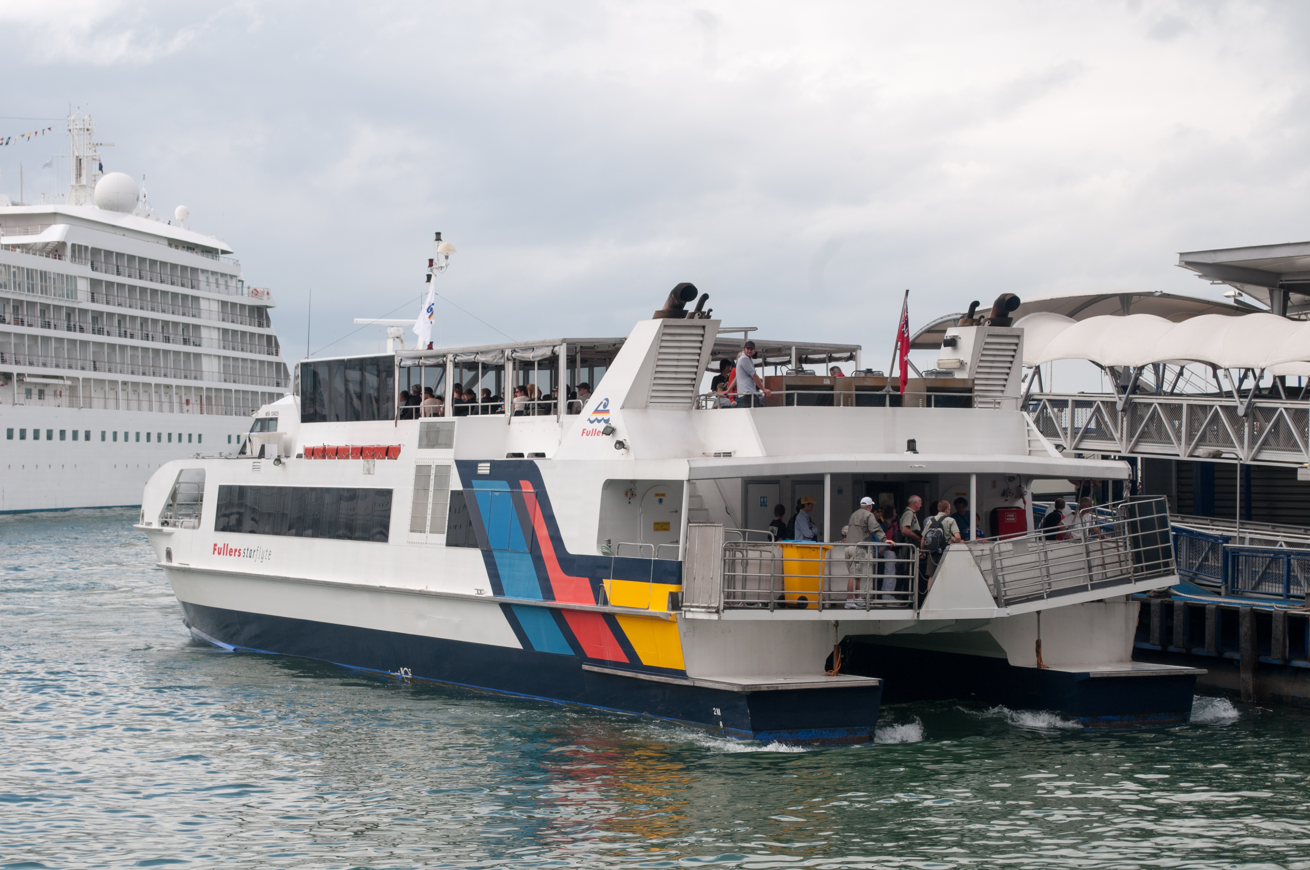 Ferry arriving at pier 3 in auckland photo