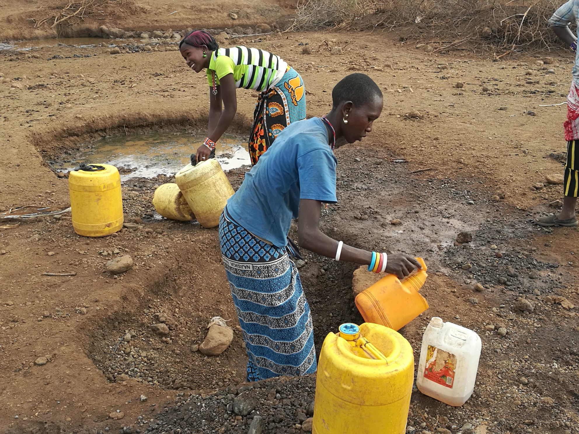 ladies fetching water - Water is Life Kenya