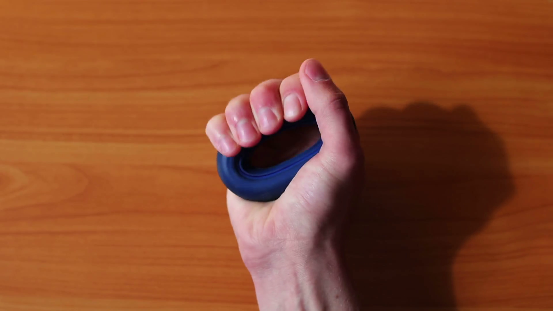 Man squeezes hand expander, strengthens muscles in hand, fingers ...